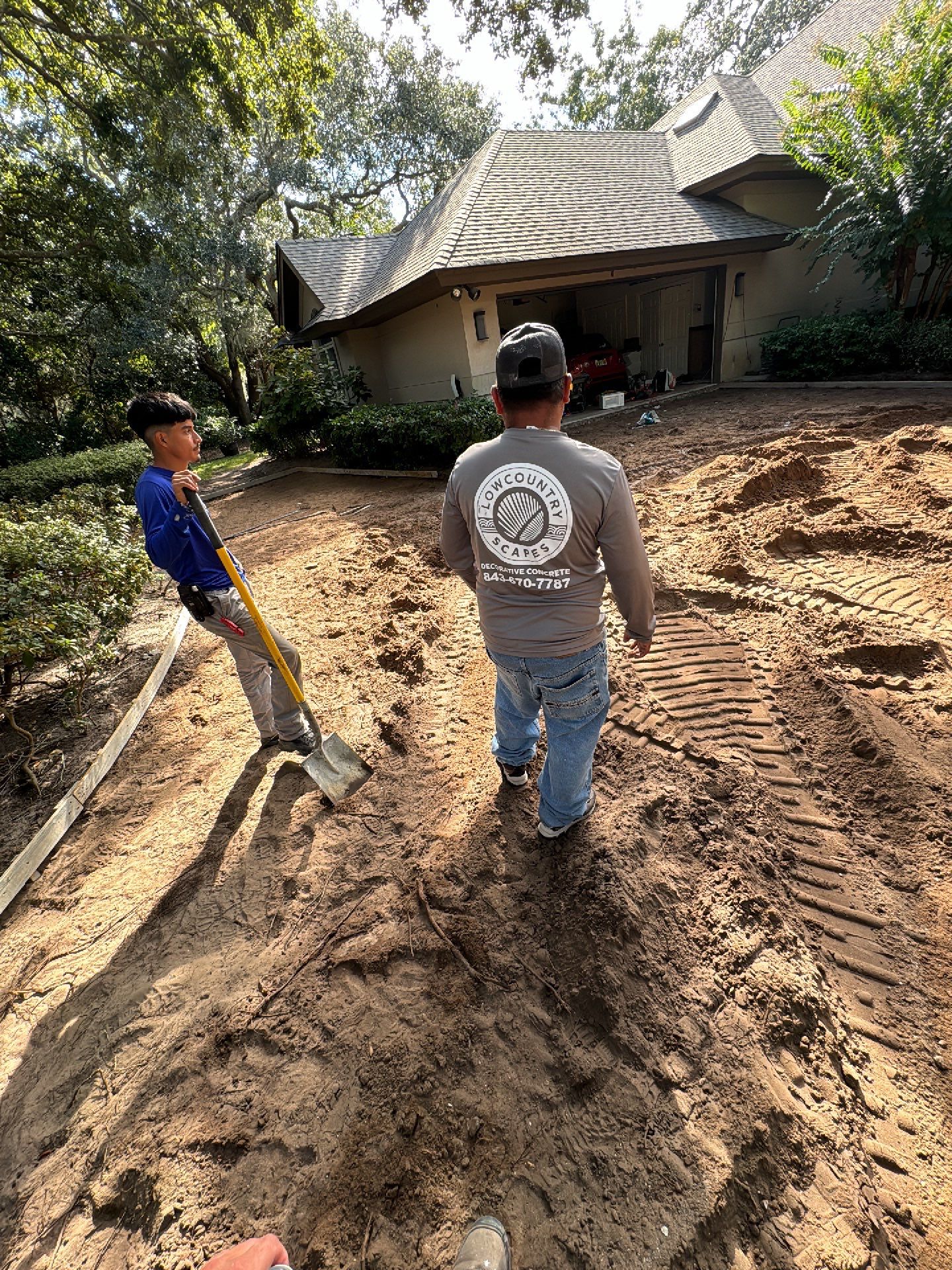 Custom Concrete Driveway with Decorative Paver Inlays in Hilton Head Island by Lowcountry Scapes, LLC