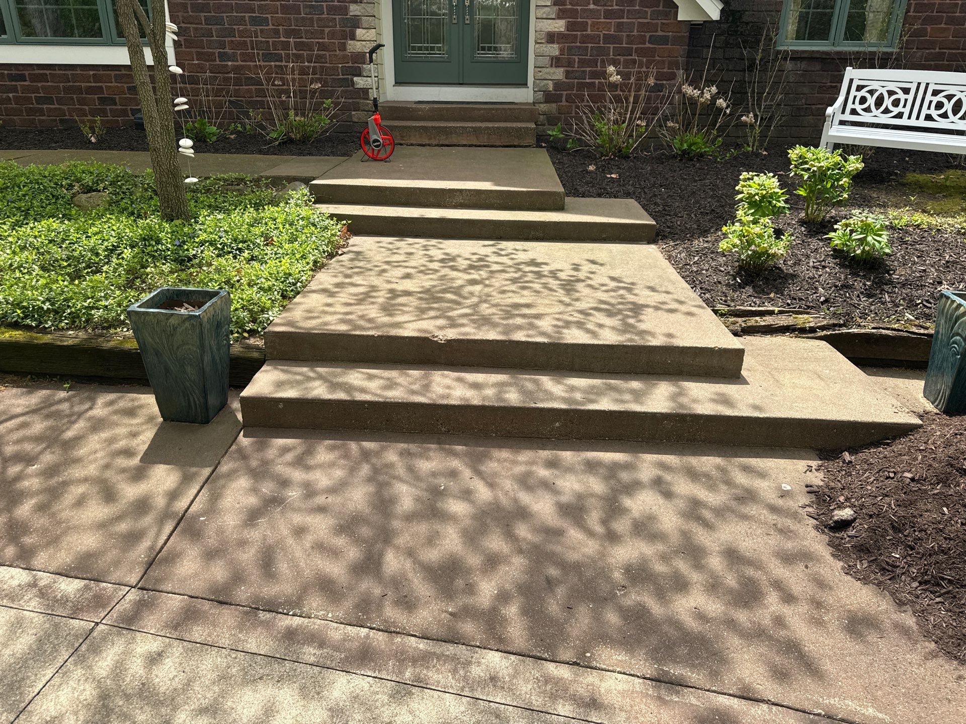 Concrete Driveway and Walkway Staining With Espresso Borders in Grand Rapids by Gordon Painting