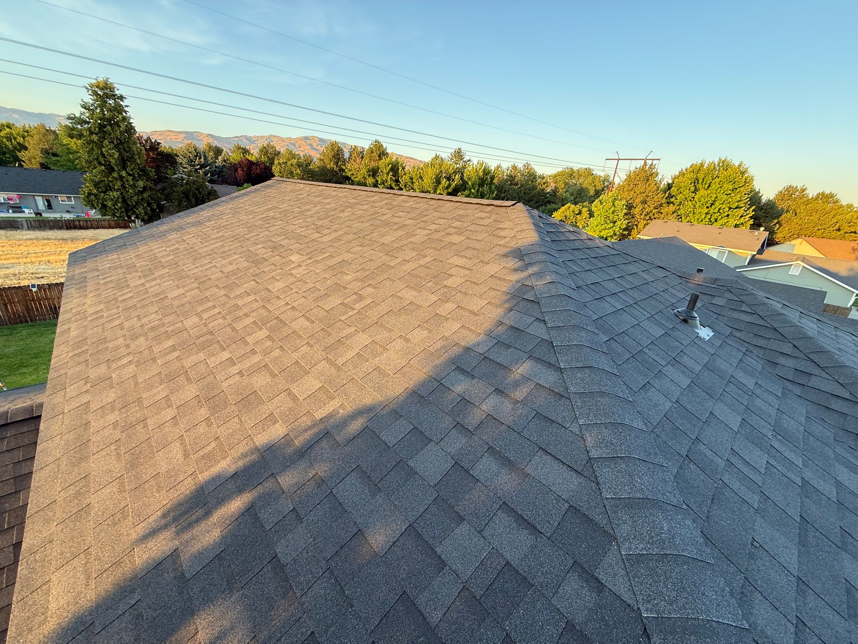 Residential Roof Replacement and Seamless Gutter Installation in Boise by Olive Roofing