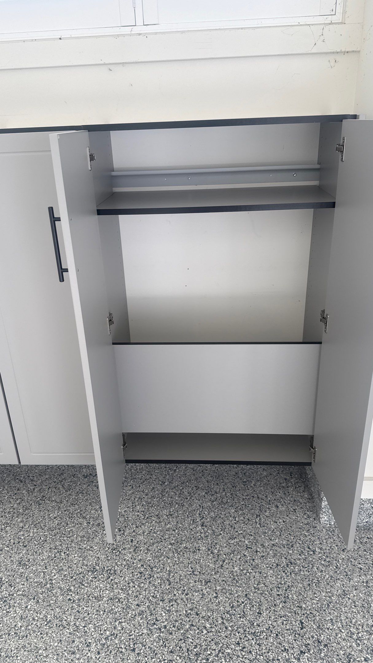 Nick's New Floor & Storage Looks Beautiful by Banner Garage