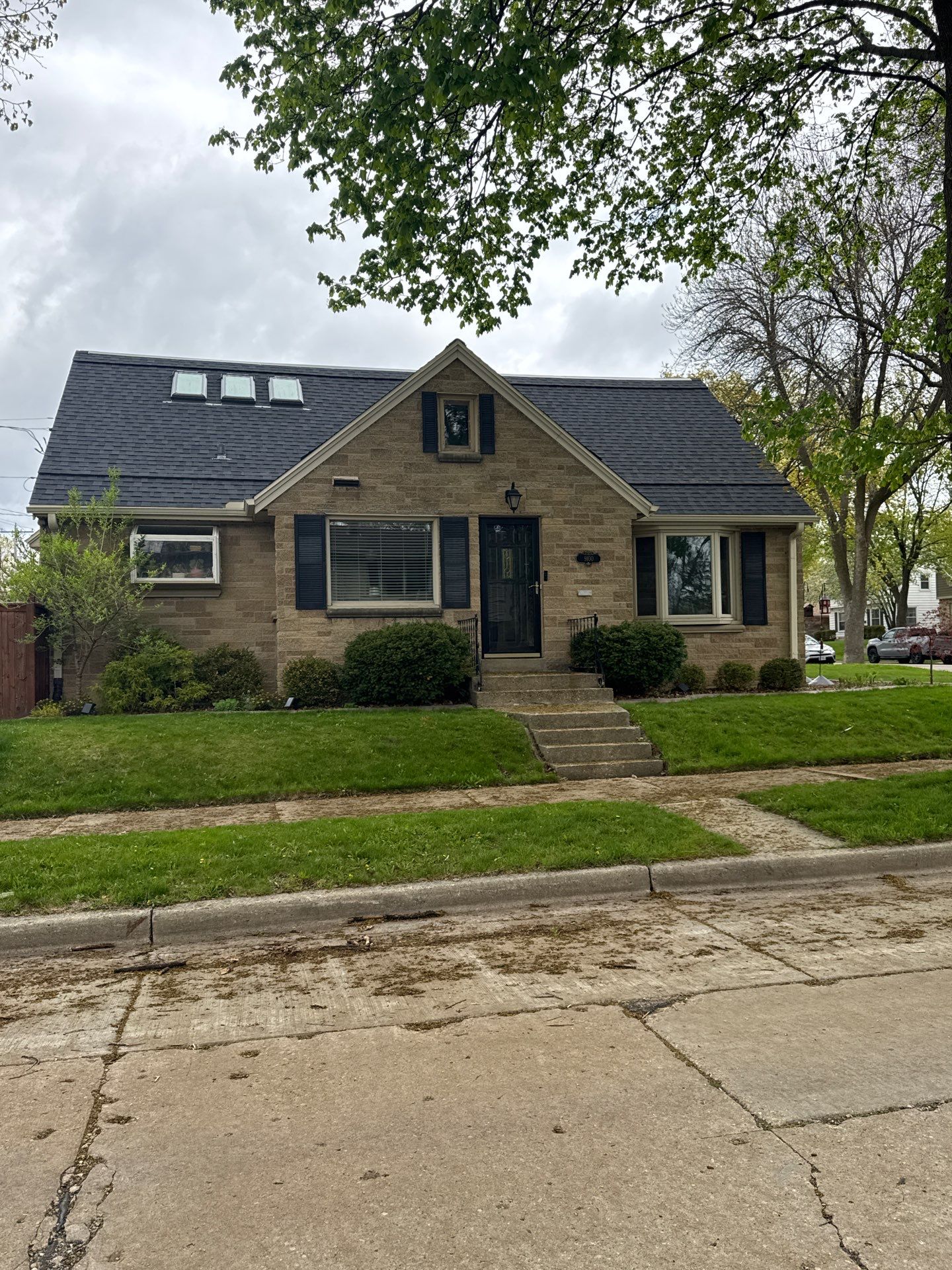 Dark Stained Privacy Fence and Composite Deck in Milwaukee by OCS Contracting Services