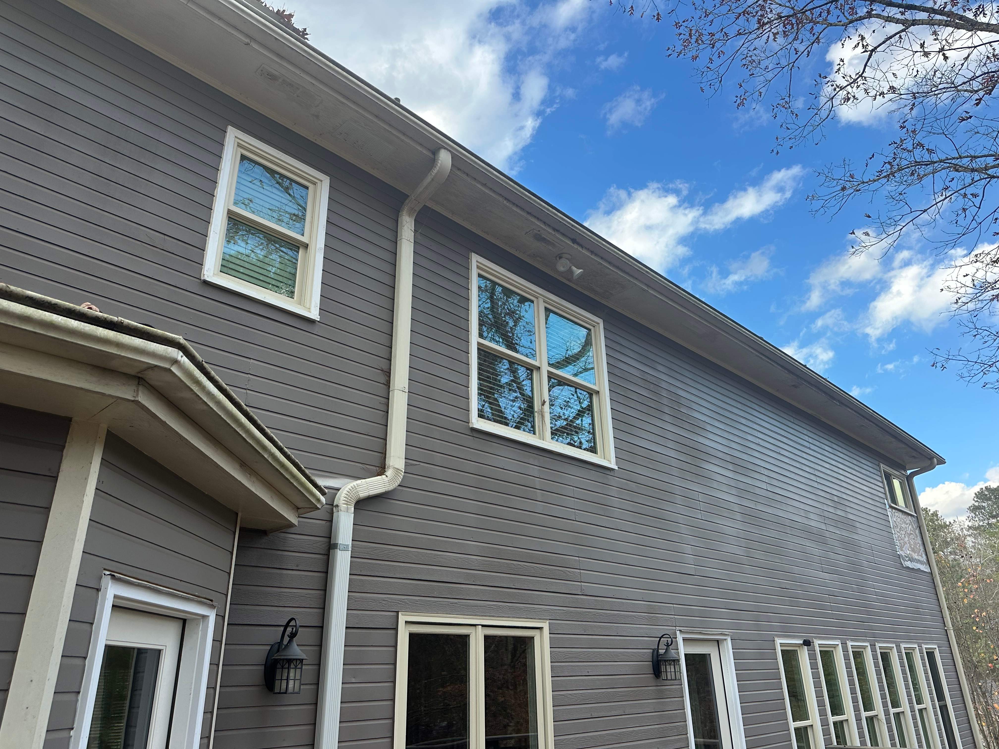 James Hardie Siding Replacement, Exterior Painting, Deck Stain, and Gutter Installation in Peachtree Corners, GA by Nelson Exteriors