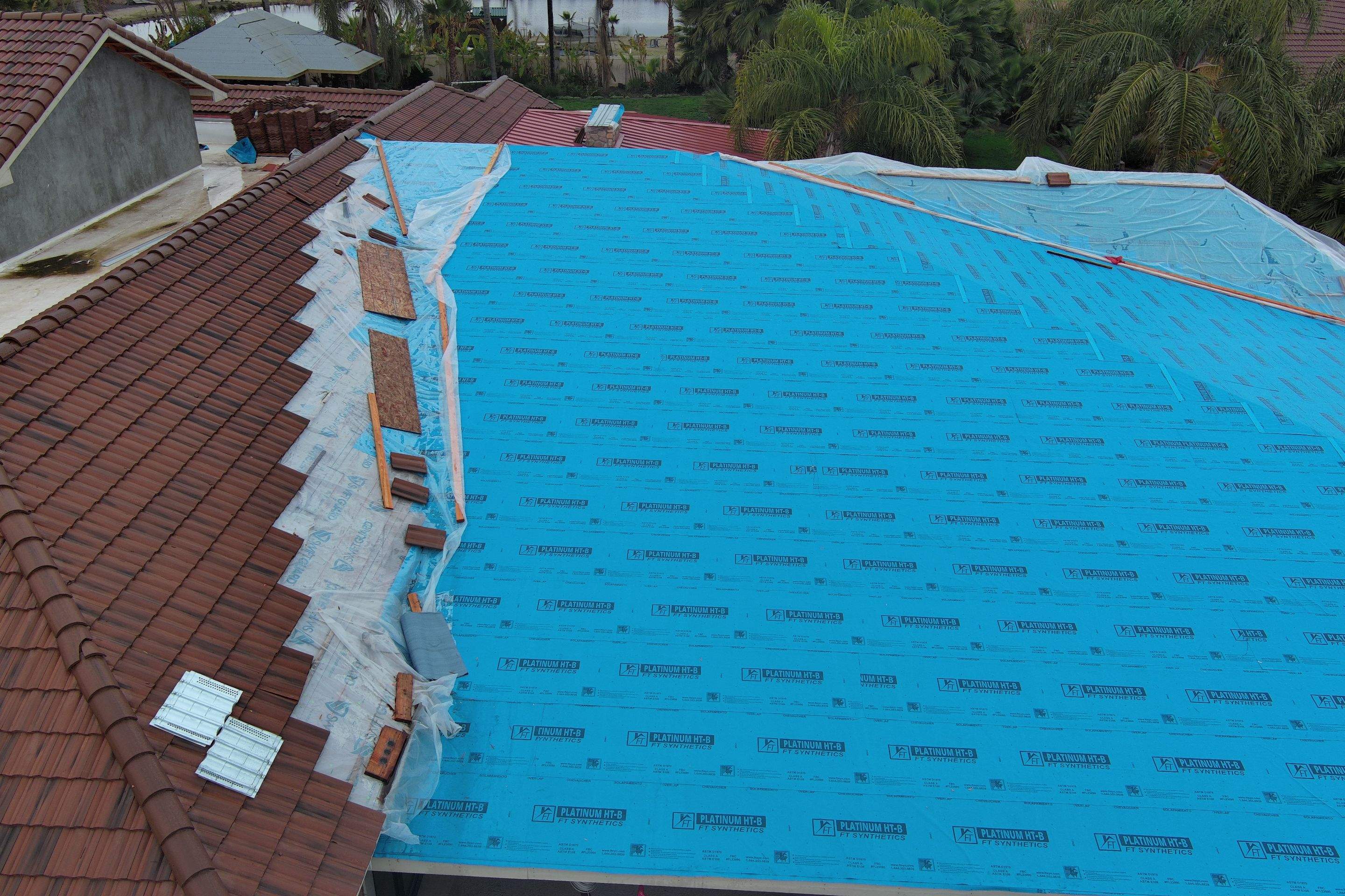 Tile, Metal, and TPO roofing project (new construction) by Straight Edge Roofing Inc