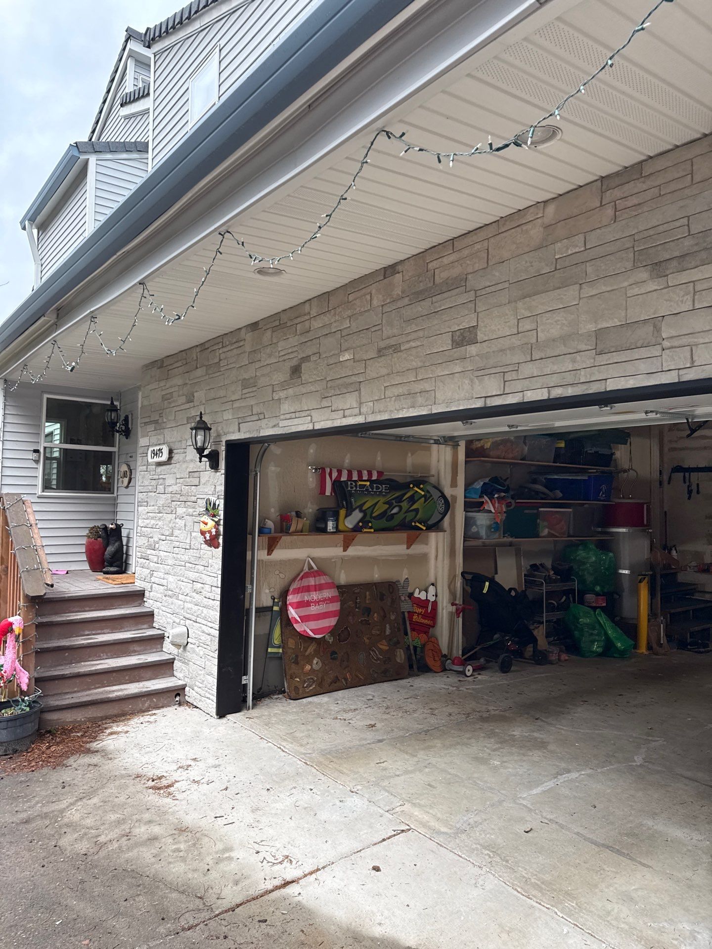 Damascus Garage Exterior Repair and Stacked Stone Veneer Installation by American Made Construction 