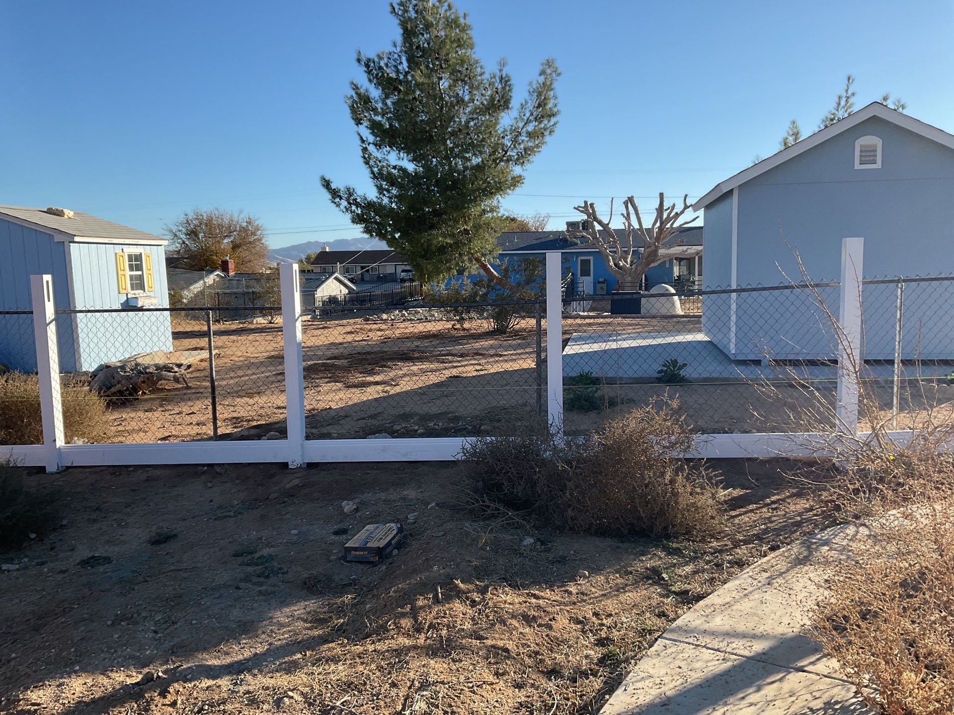 Fence Installation using vinyl and chain link  by Fence Guys Inc. 