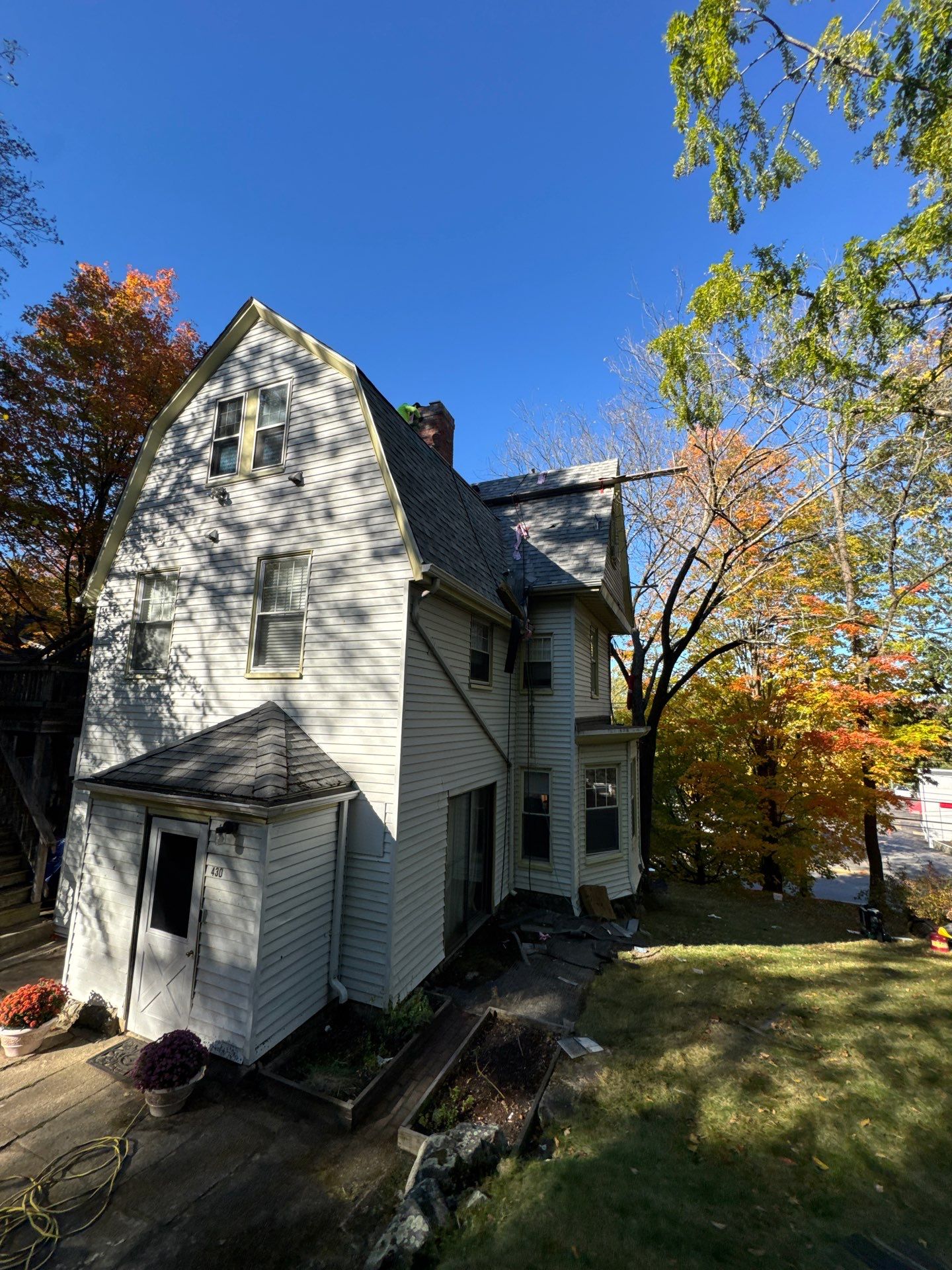 Full Roof & Porch EPDM Replacement with Skylight and Chimney Repairs by Mighty Dog Roofing of Greater Middlesex County