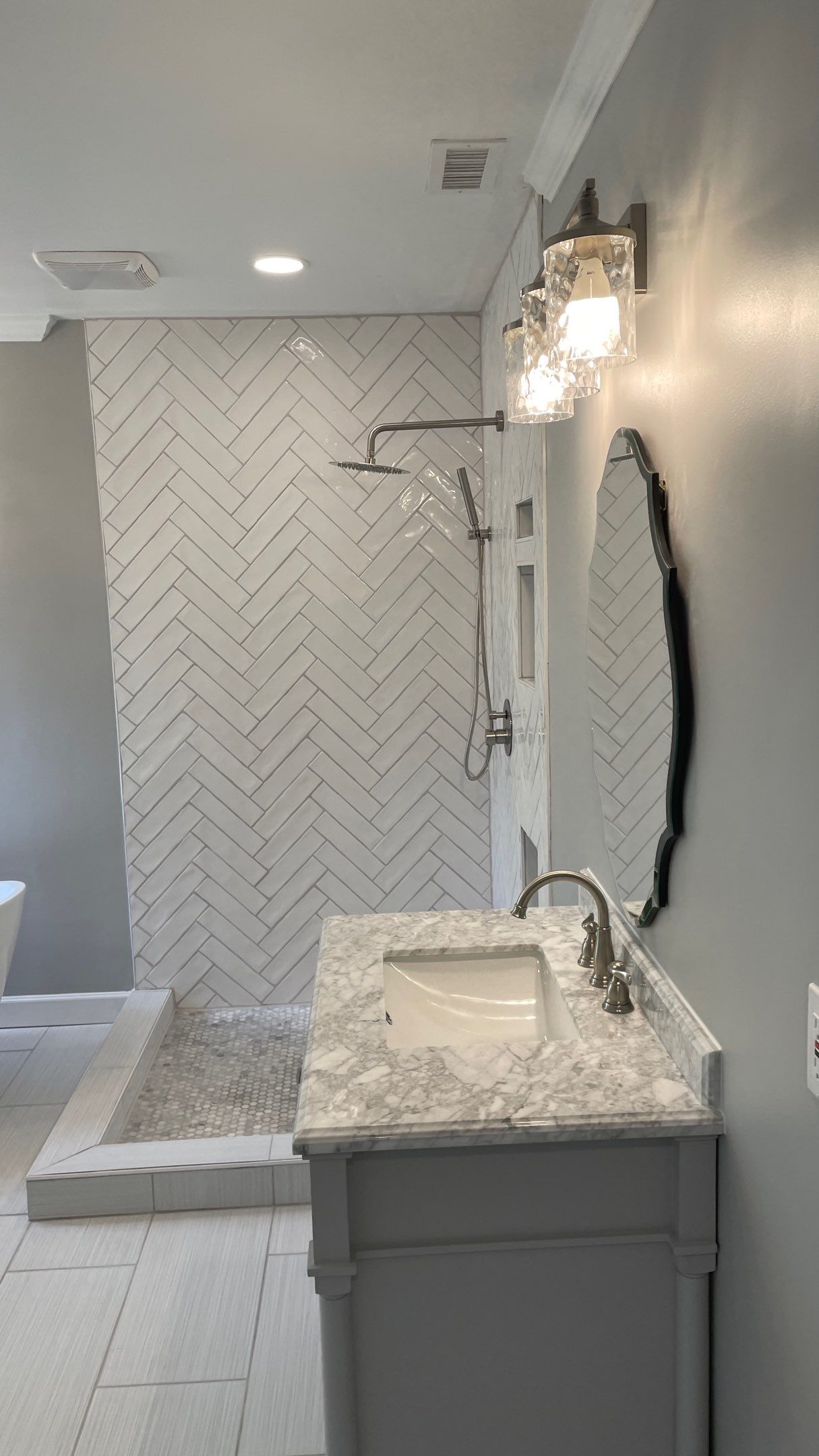 Bathroom Remodel using Schluter by Footprints Floors of Coastal Carolina