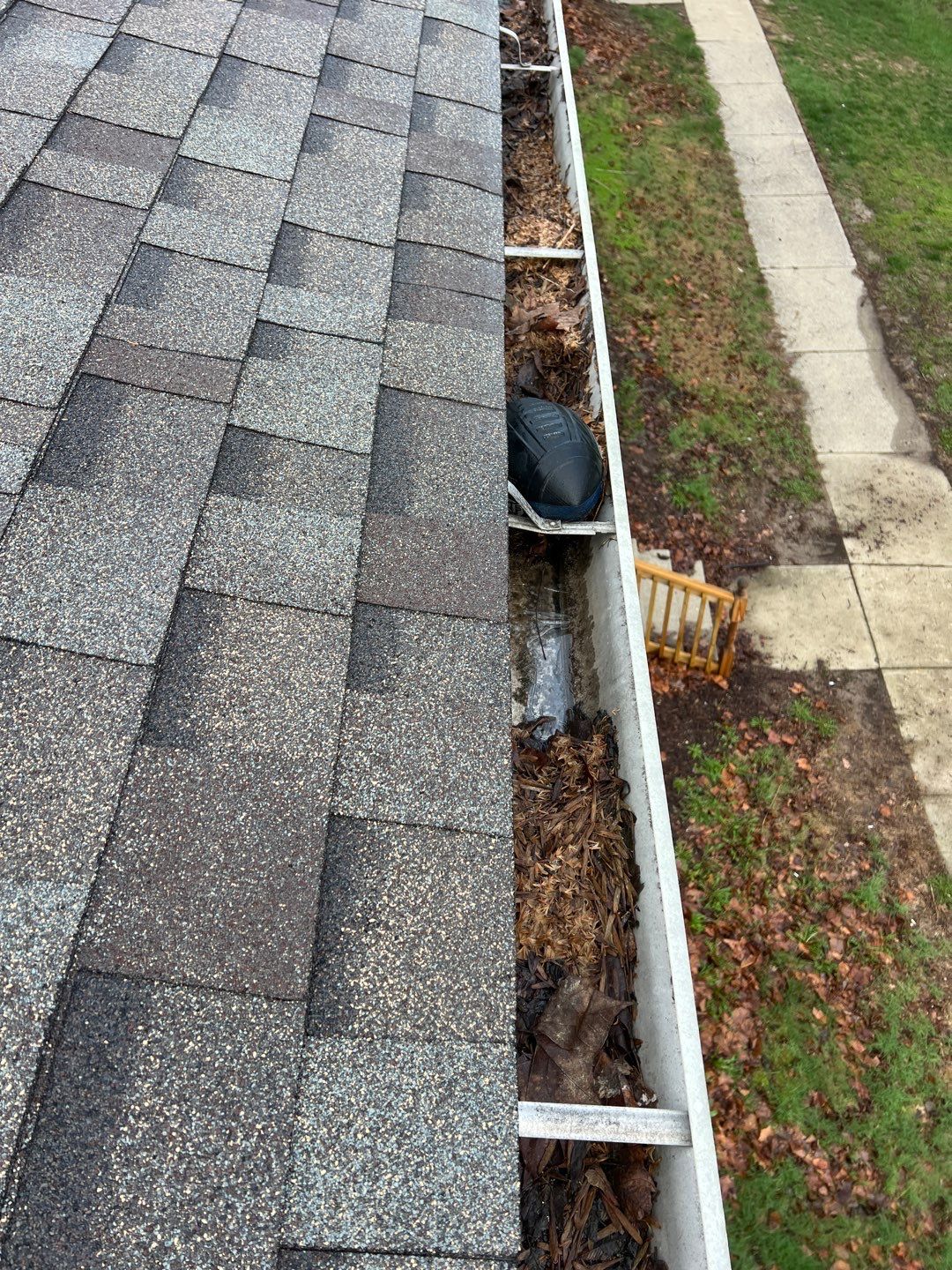 Commercial gutter cleaning Indiana before photo with filled gutters