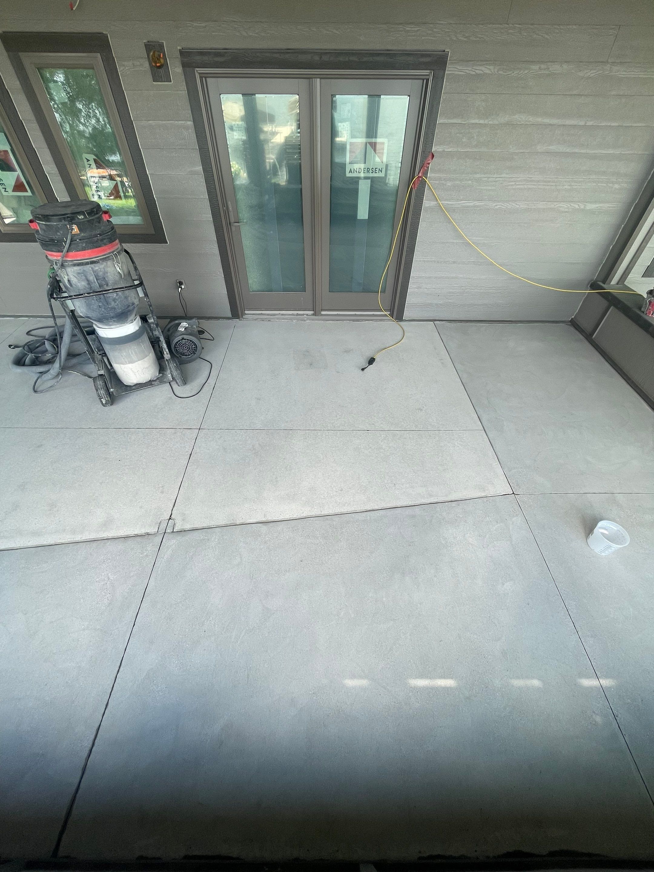 Lakefront Screened Patio Concrete Coating Installation in Wentworth by Select Painting, Coatings & Garage Cabinets