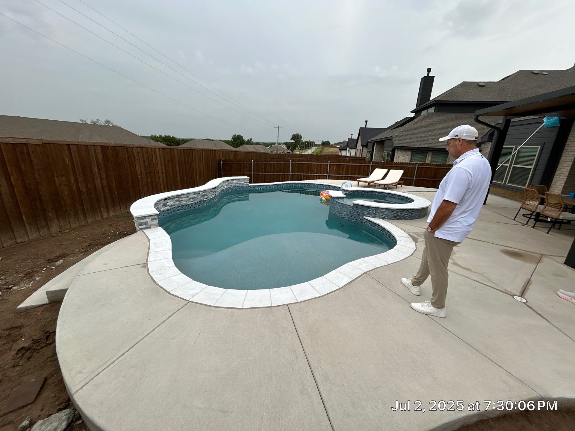 Freeform Pool with Raised Stone Spa by Pinnacle Pools and Spas - DFW