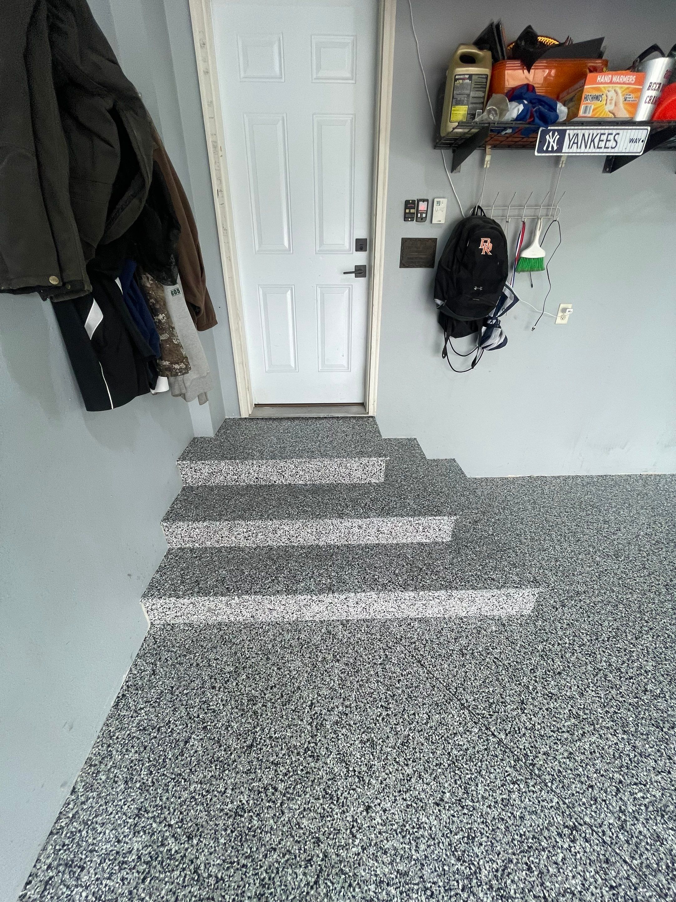 Full Garage Floor Epoxy Coating Installation in Dell Rapids by Select Painting, Coatings & Garage Cabinets