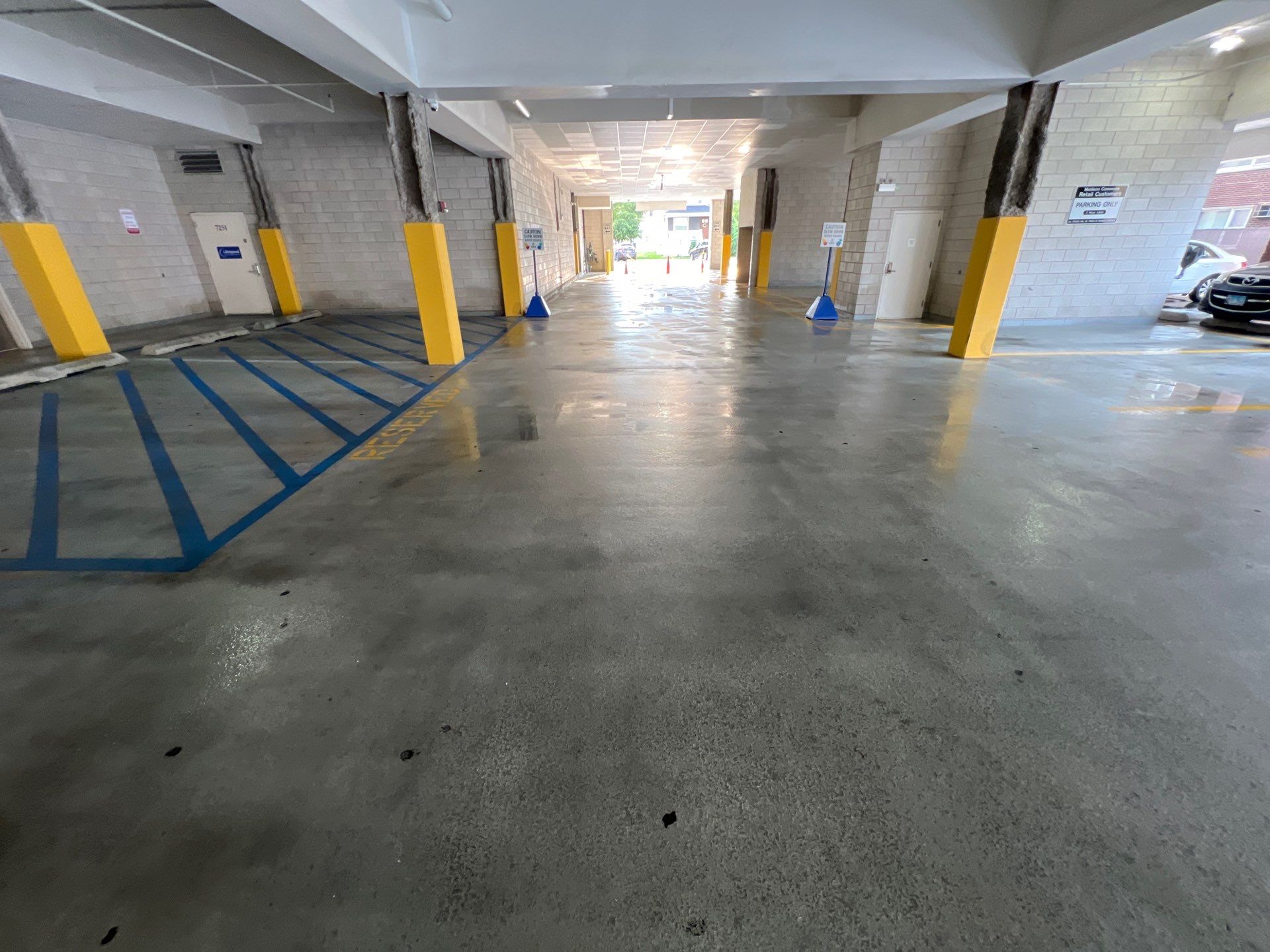 Parking garage using Hot water by Northern Power Washing LLC.