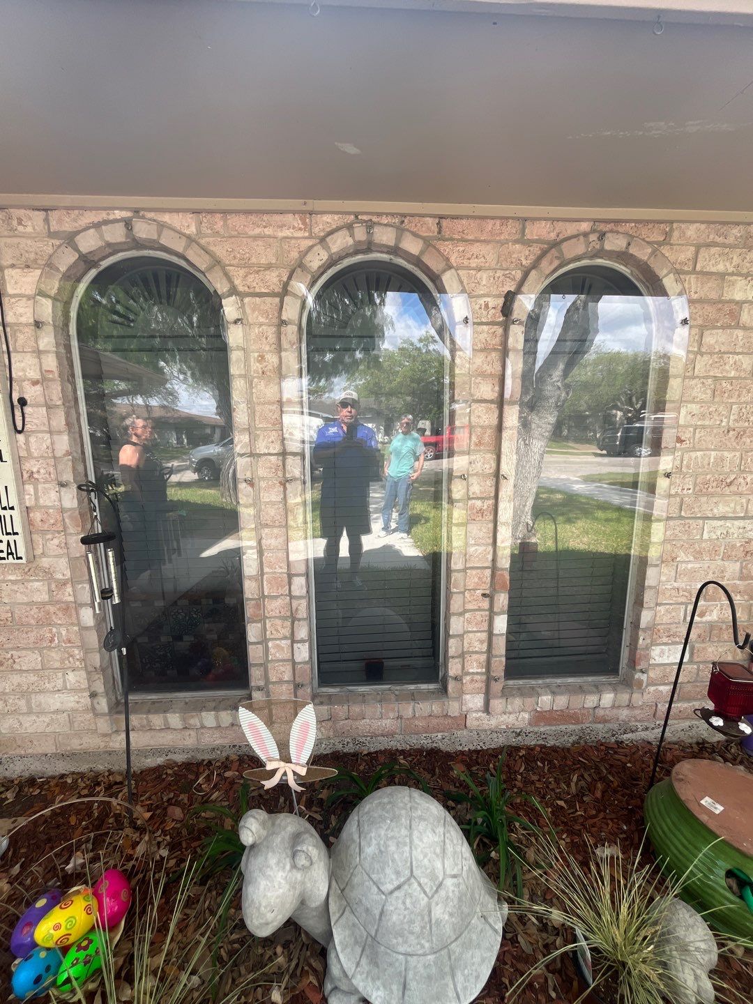 Colored Vinyl Windows to blend into brick by Bayfront Roofing and Construction