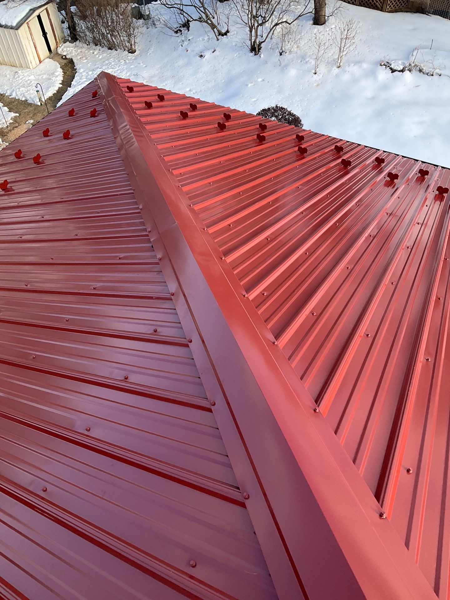 Red Metal Roofing Upgrade for Brick Home by Esh Builders