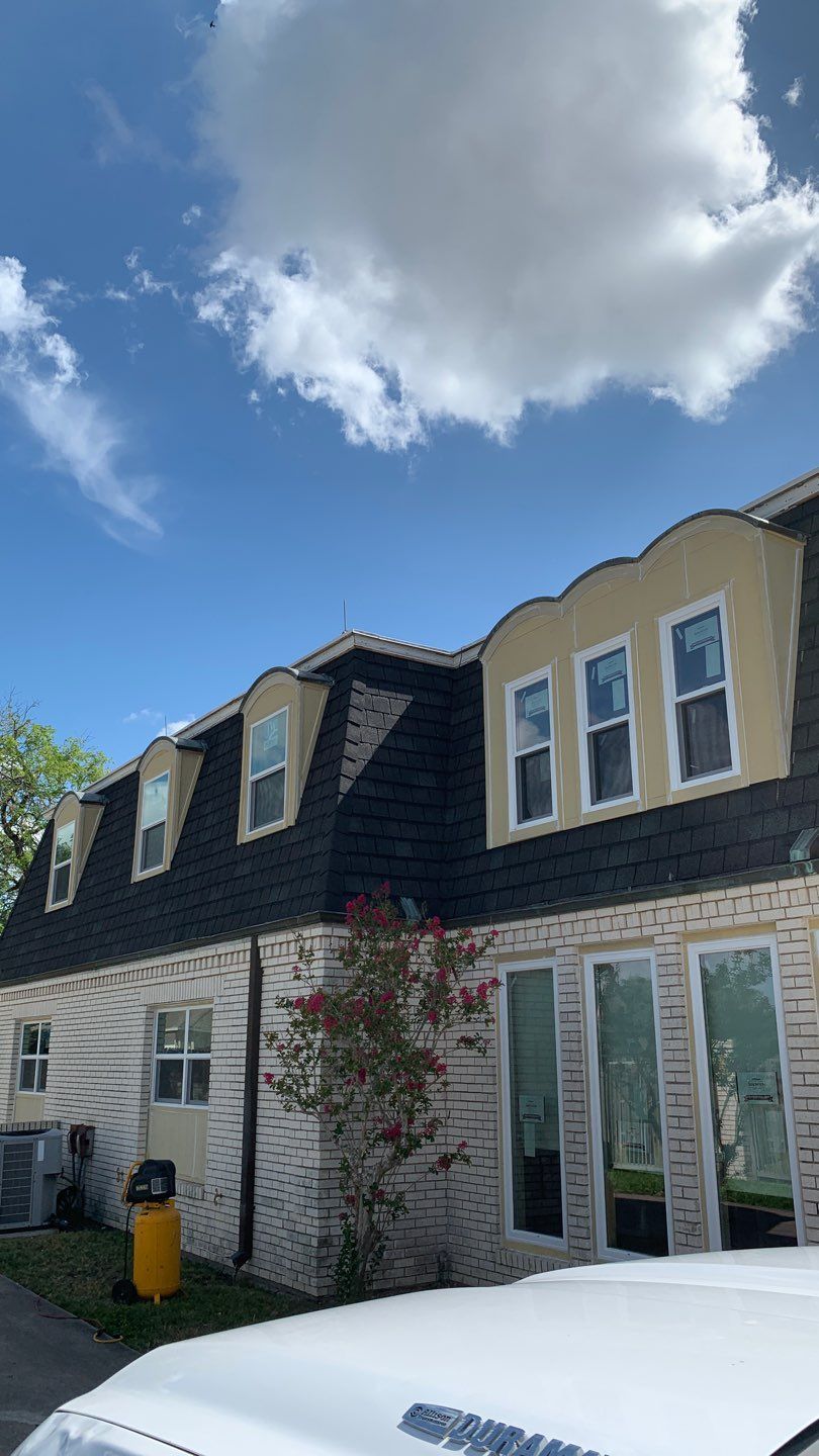 Mansard Charm by Bayfront Roofing and Construction
