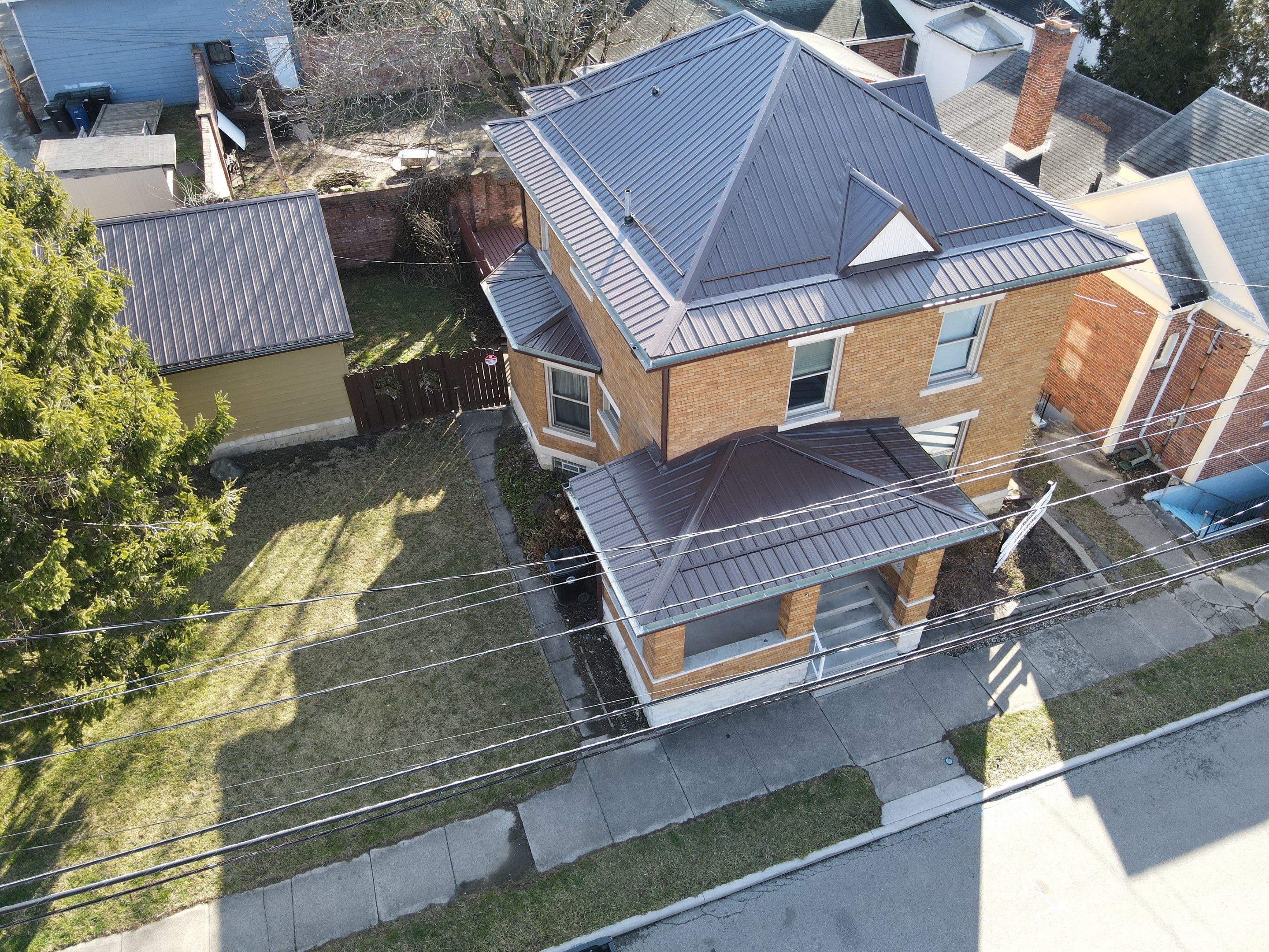 Residential Roofing Installation using Performance Panel Metal - Brown by RoofX