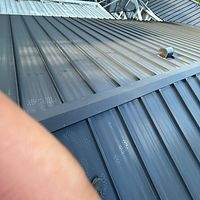 .032 Aluminum 1.5" Mechanical Seam Matte Black  by Total Roofing System The Metal Roof Experts