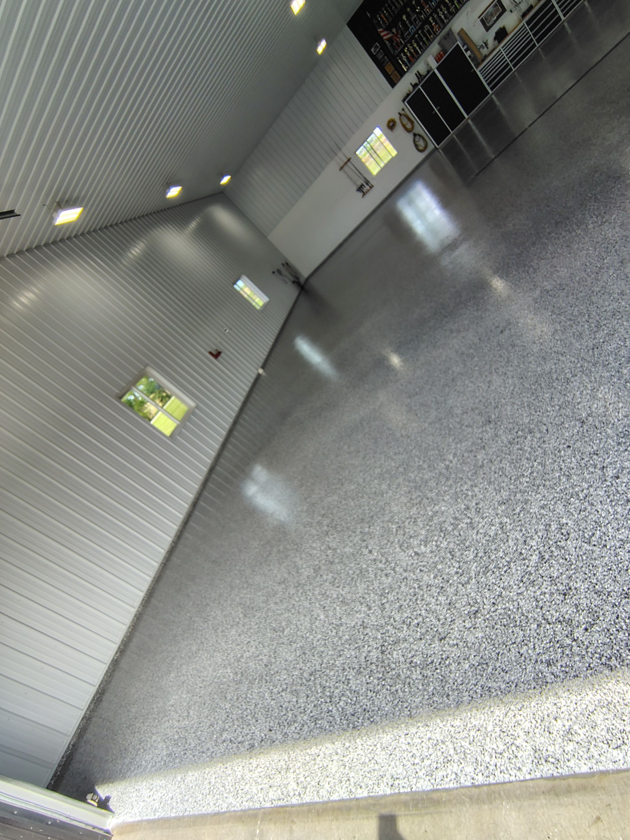 Multi-Stage Concrete Floor Coating for Egan Shop and RV Storage by Select Painting, Coatings & Garage Cabinets