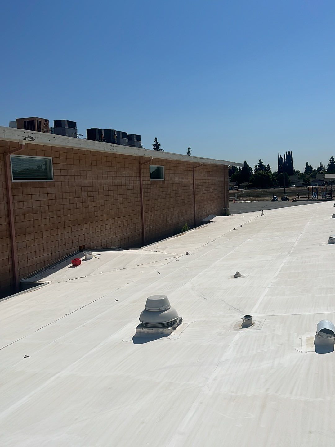 MR Roofing system using Benchmark/PUMA XL coatings over TPO single-ply roofing by Straight Edge Roofing Inc