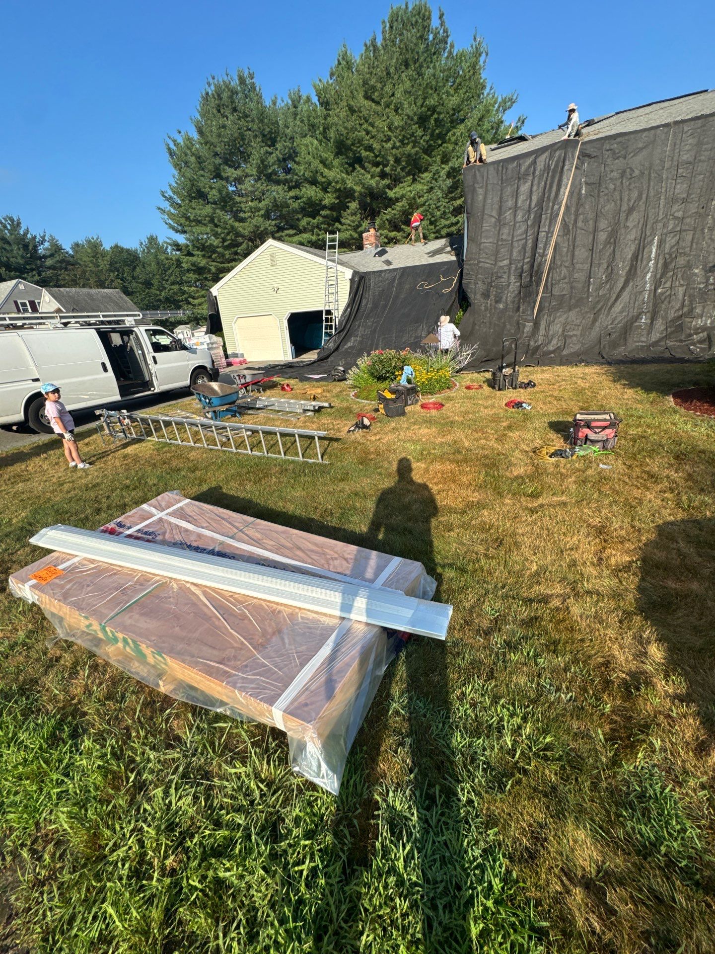 Complete Roof Replacement with Chimney Flashing, Gutter Guard System, and Vinyl Siding Repairs by Mighty Dog Roofing of Greater Middlesex County