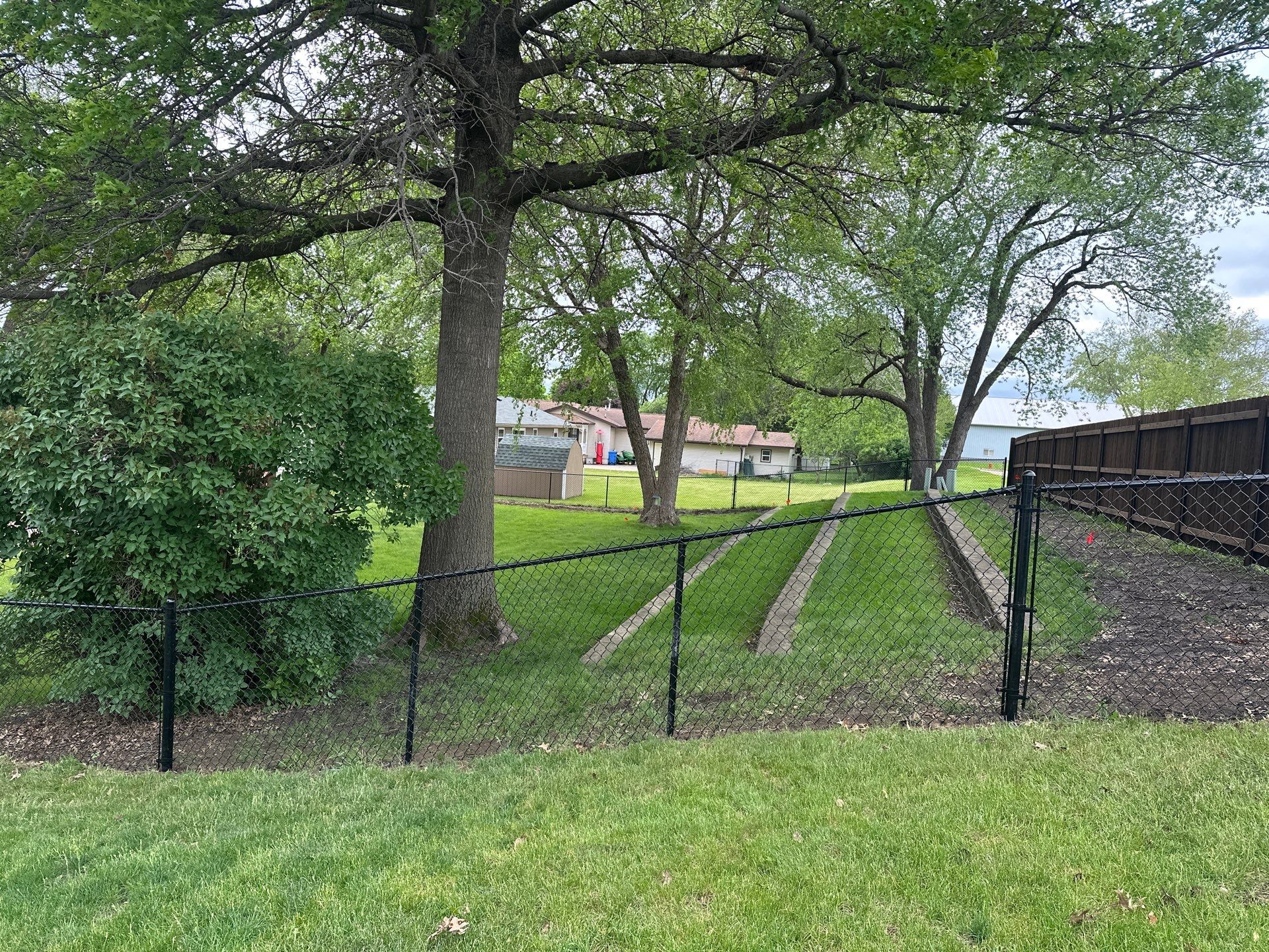 Chain Link and Cedar Privacy in Grundy Center by Perfect Picket Fence and Stain