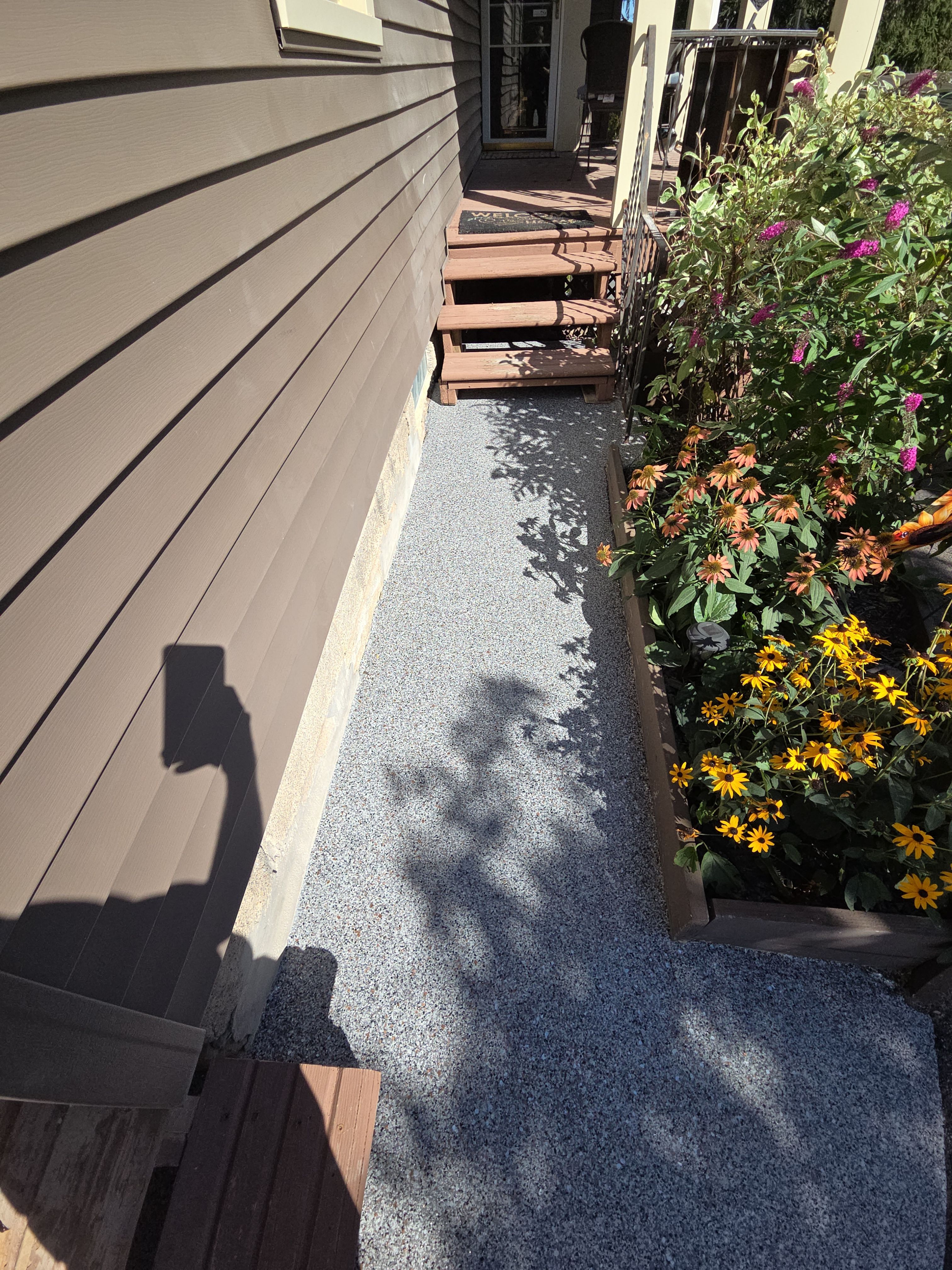 Earth Effects Stardust Sidewalk Coating by NG Masonry & Construction LLC