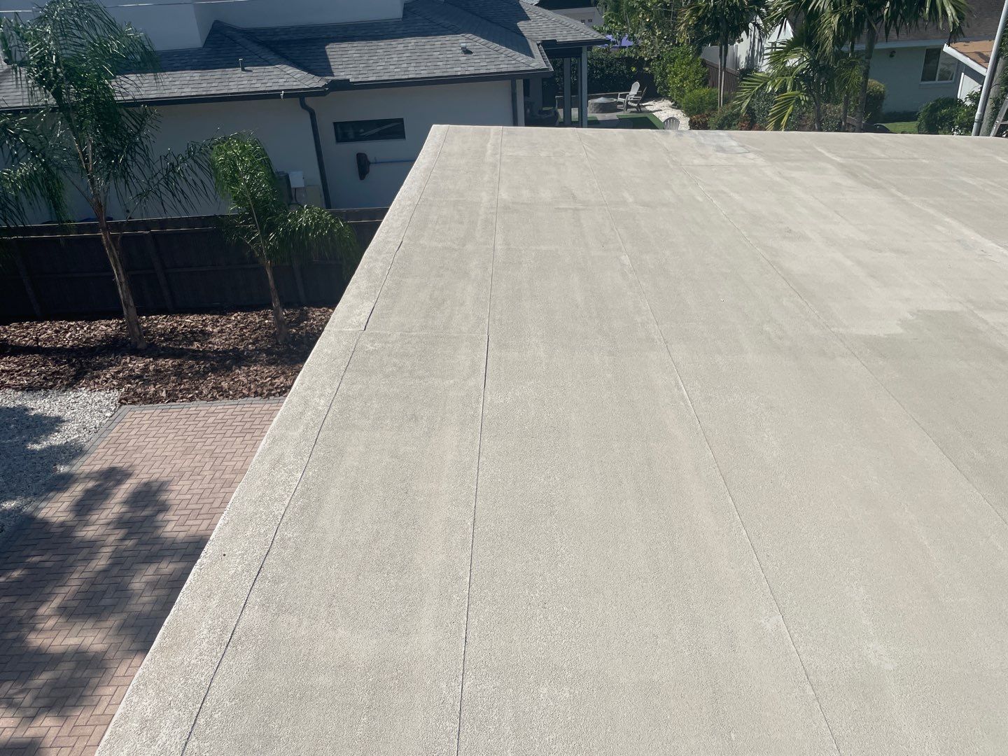Residential Flat Roof Membrane and Tile Accents in Winter Park by Tip Top Roofing Co., Inc.