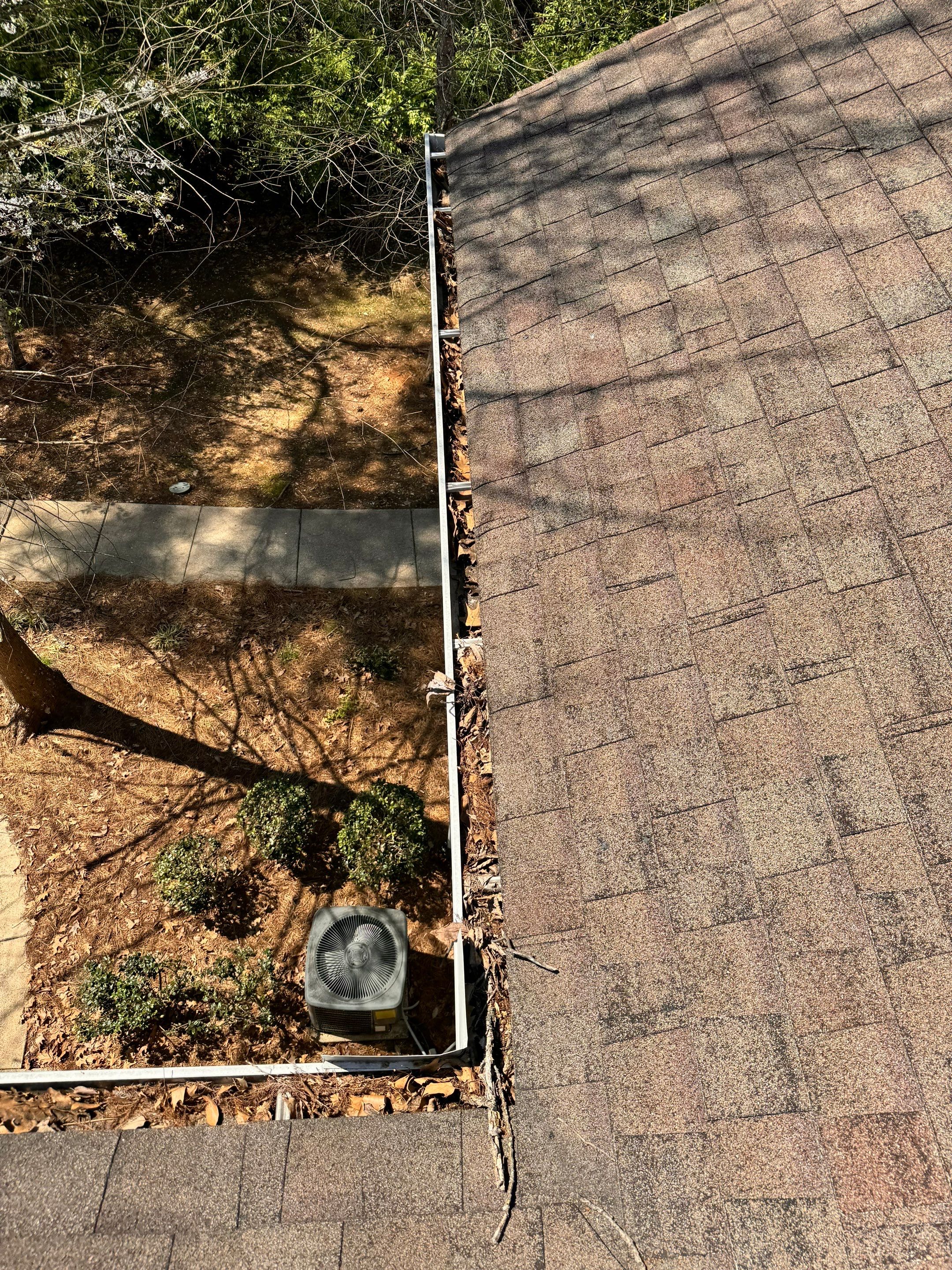 Commercial gutter cleaning Huntsville, AL before photo with filled gutters