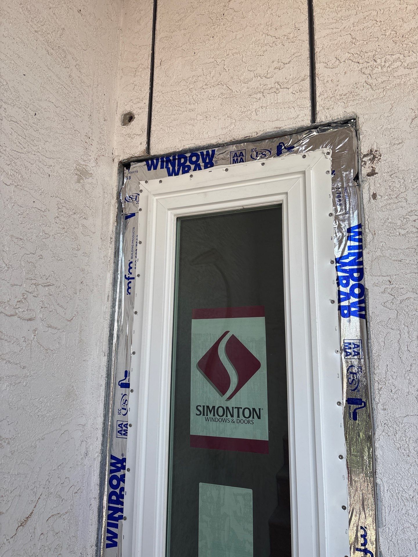 Installing Windows on a Submarine  by Bayfront Roofing and Construction