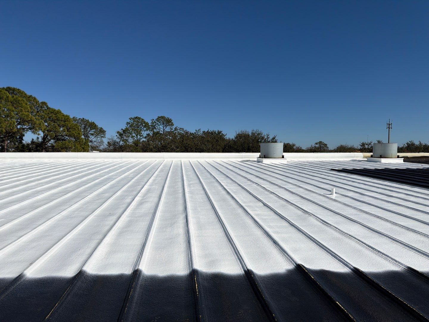 Sarasota Industrial Warehouse Metal Roof Silicone Coating Restoration by CES Roofing