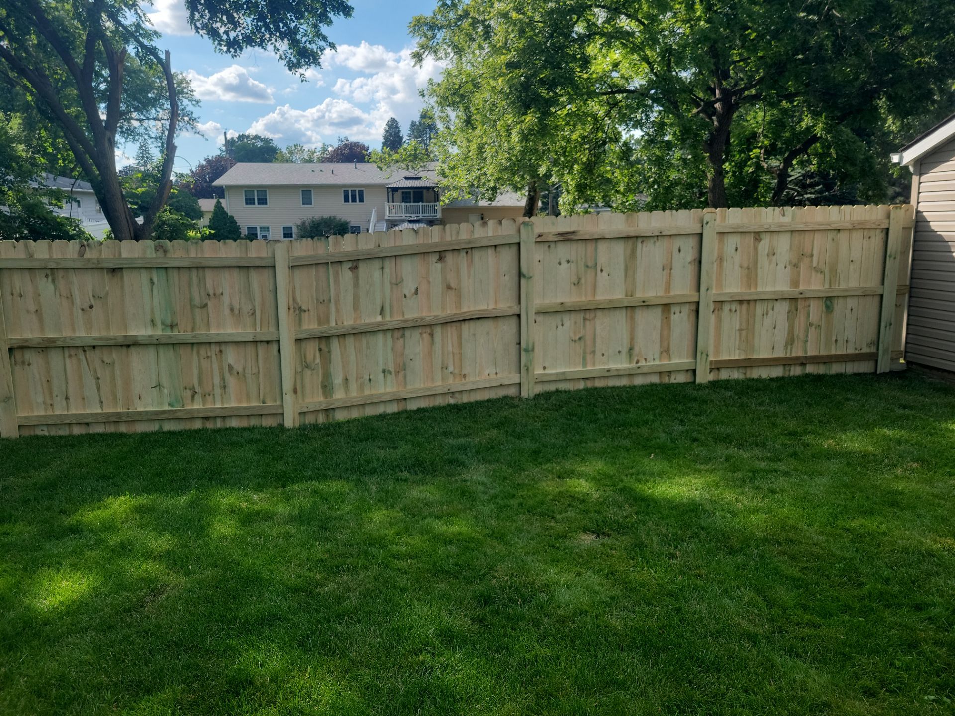 Pressure-Treated Pine Privacy Fence and Custom Gates in Waterloo by Perfect Picket Fence and Stain