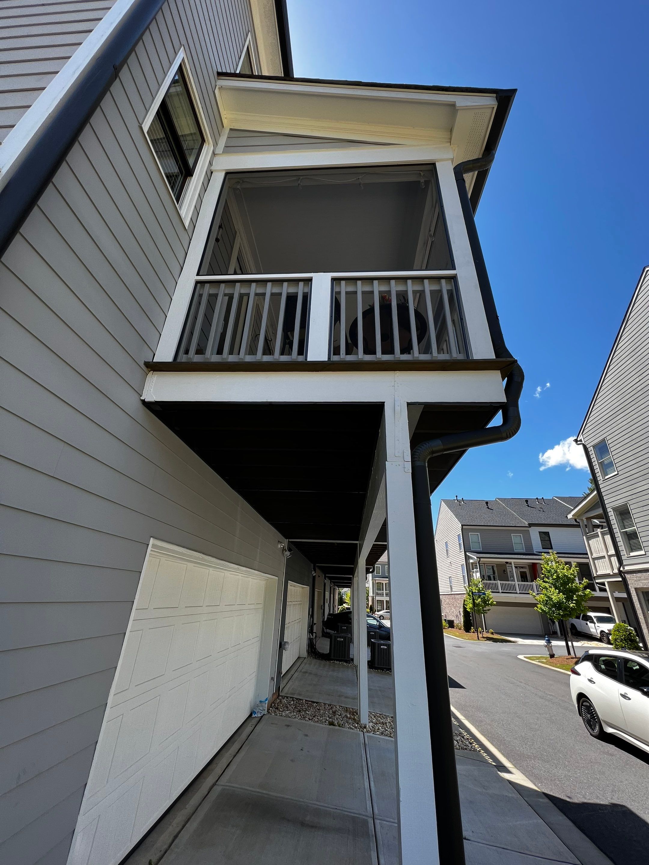 Custom Screened-in Porch Addition Above Garage in Woodstock by Swift Home Renovations
