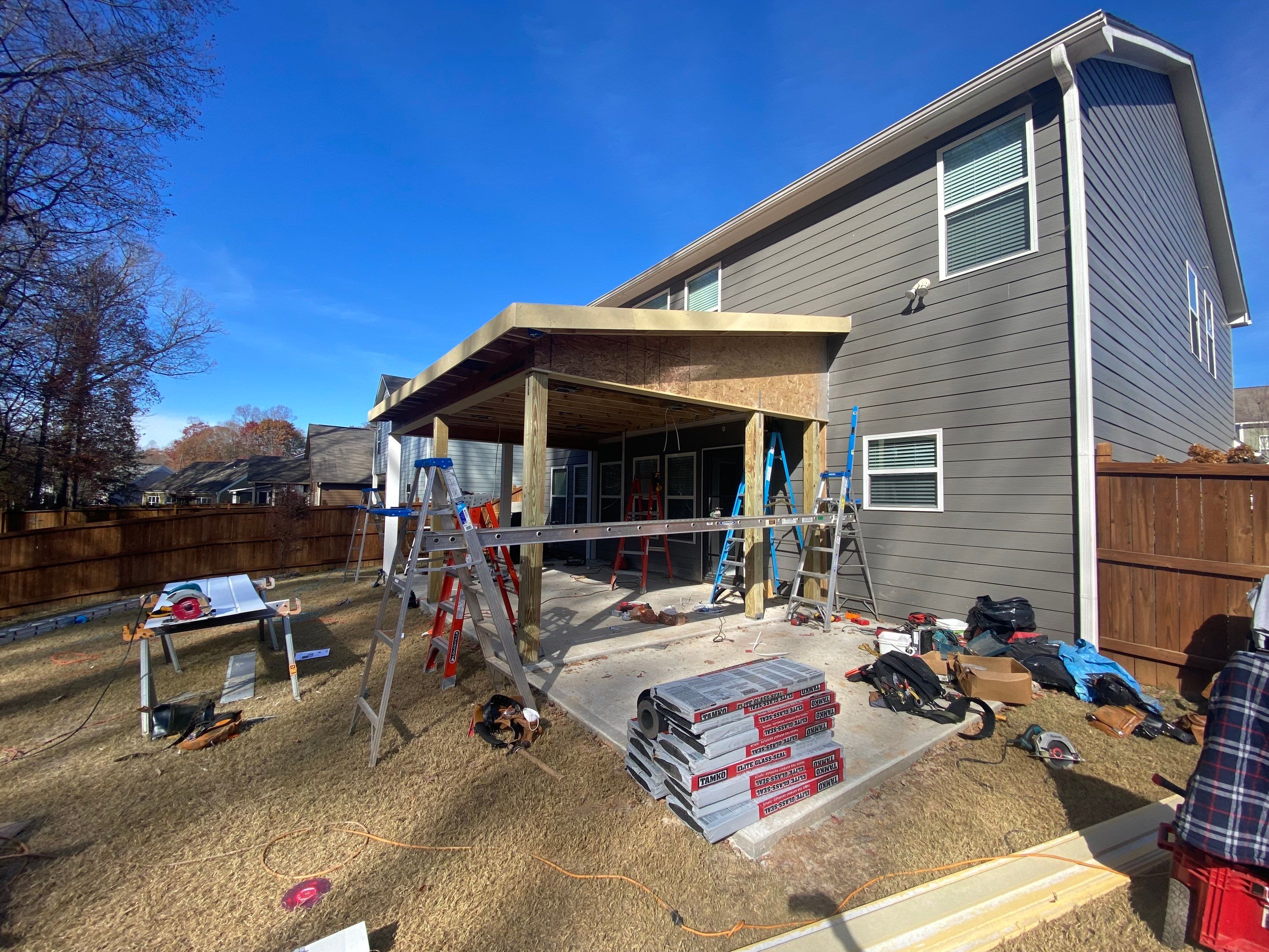 Screened-In Porch Construction With White Beadboard Ceiling In Cumming by Swift Home Renovations 