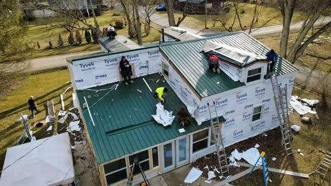 Green Metal Roof Installation and Exterior Renovation in Thornville by Canopy Contracting