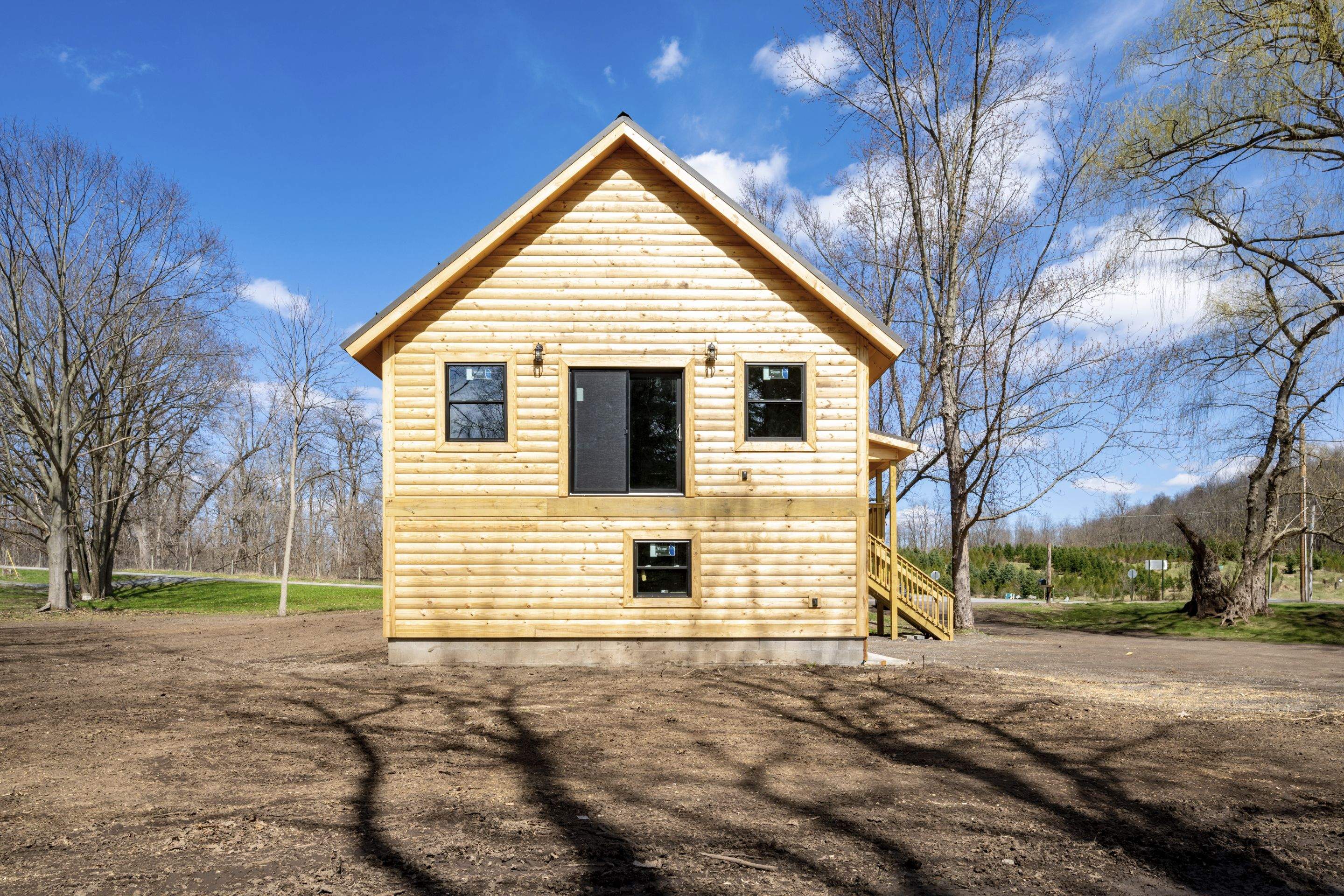 New Addition to Home using Log Cabin Siding  by Horst Custom Homes 