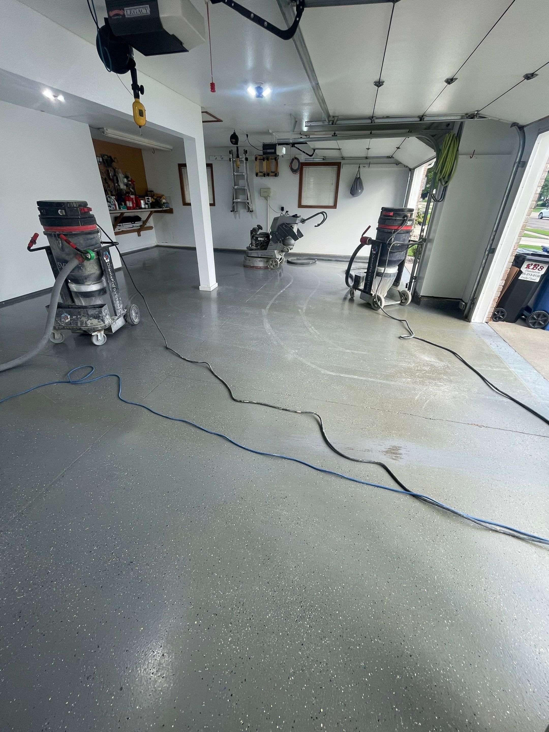 Multi-Car Garage Concrete Coating with Coyote Flake Finish in Sioux Falls by Select Painting, Coatings & Garage Cabinets