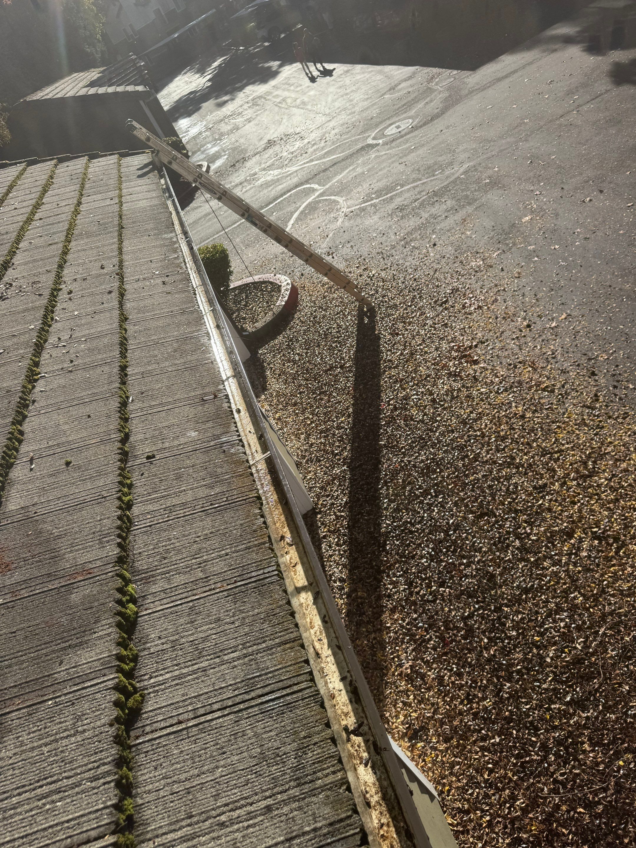 HOA gutter cleaning in Folsom & El Dorado Hills, after  photo showing full gutters.