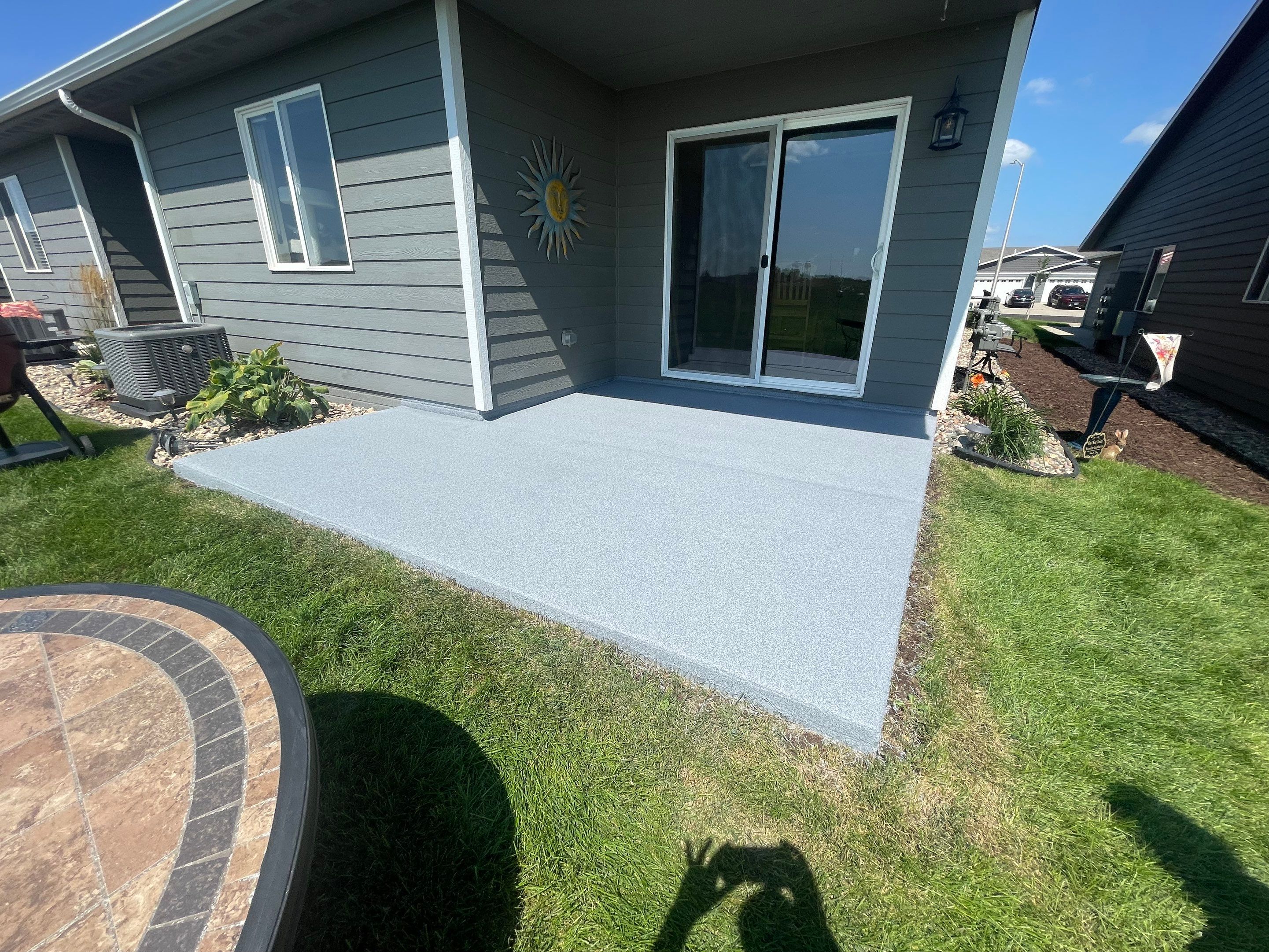 Starry Evening Concrete Patio Coating Installation in Tea by Select Painting, Coatings & Garage Cabinets