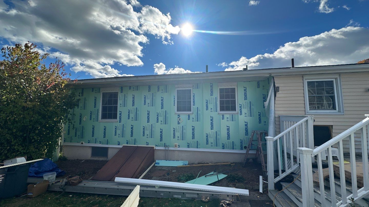 Transformative Siding update with Cert. Monogram D/4 x 12'6" Clapboard, Heritage Cream by DiGiorgi Roofing and Siding Inc