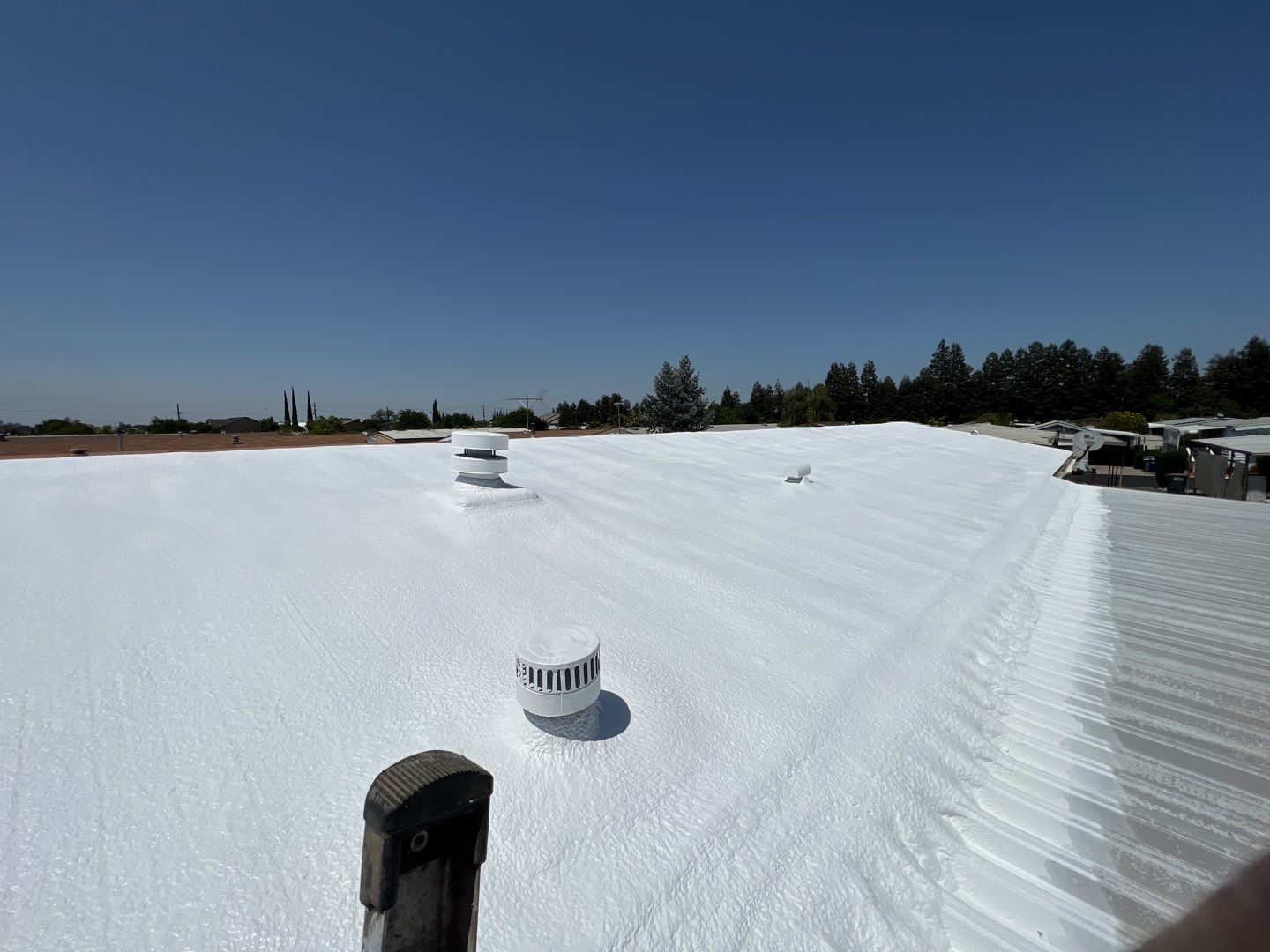 Spray foam and coatings using General Coatings acrylic coatings and spray foam by Straight Edge Roofing Inc