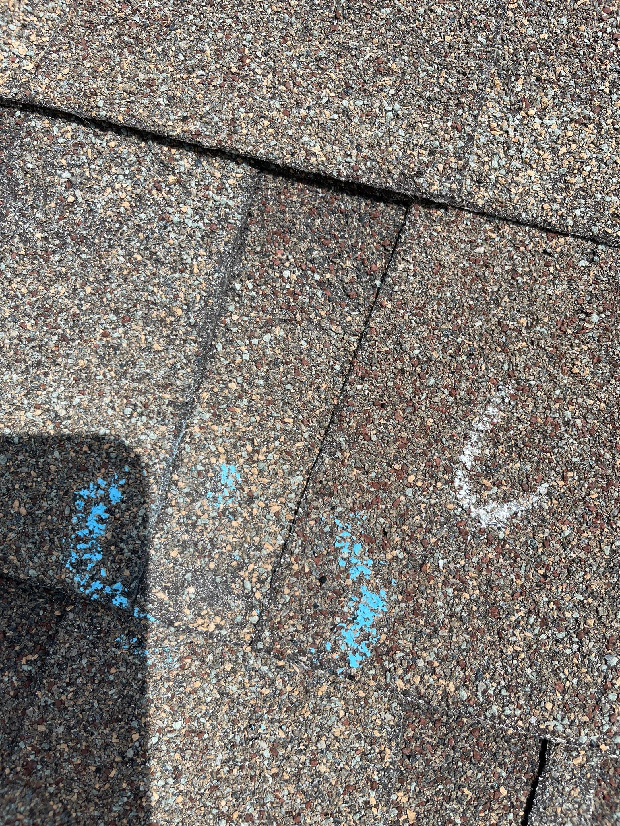 Hail Damage on a Roofing System by Icon Roofing And Construction 
