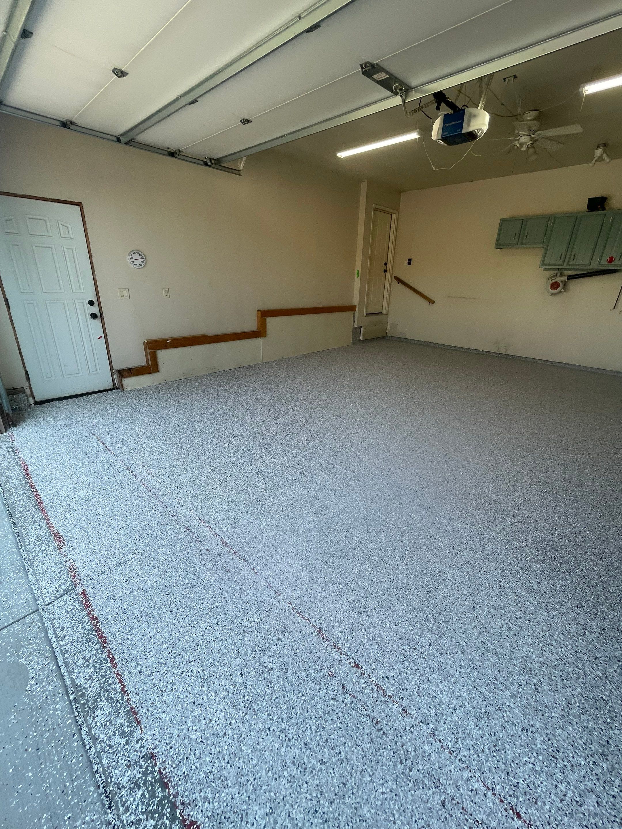 Multi-Stall Garage Floor Coating Installation in Sioux Falls by Select Painting, Coatings & Garage Cabinets
