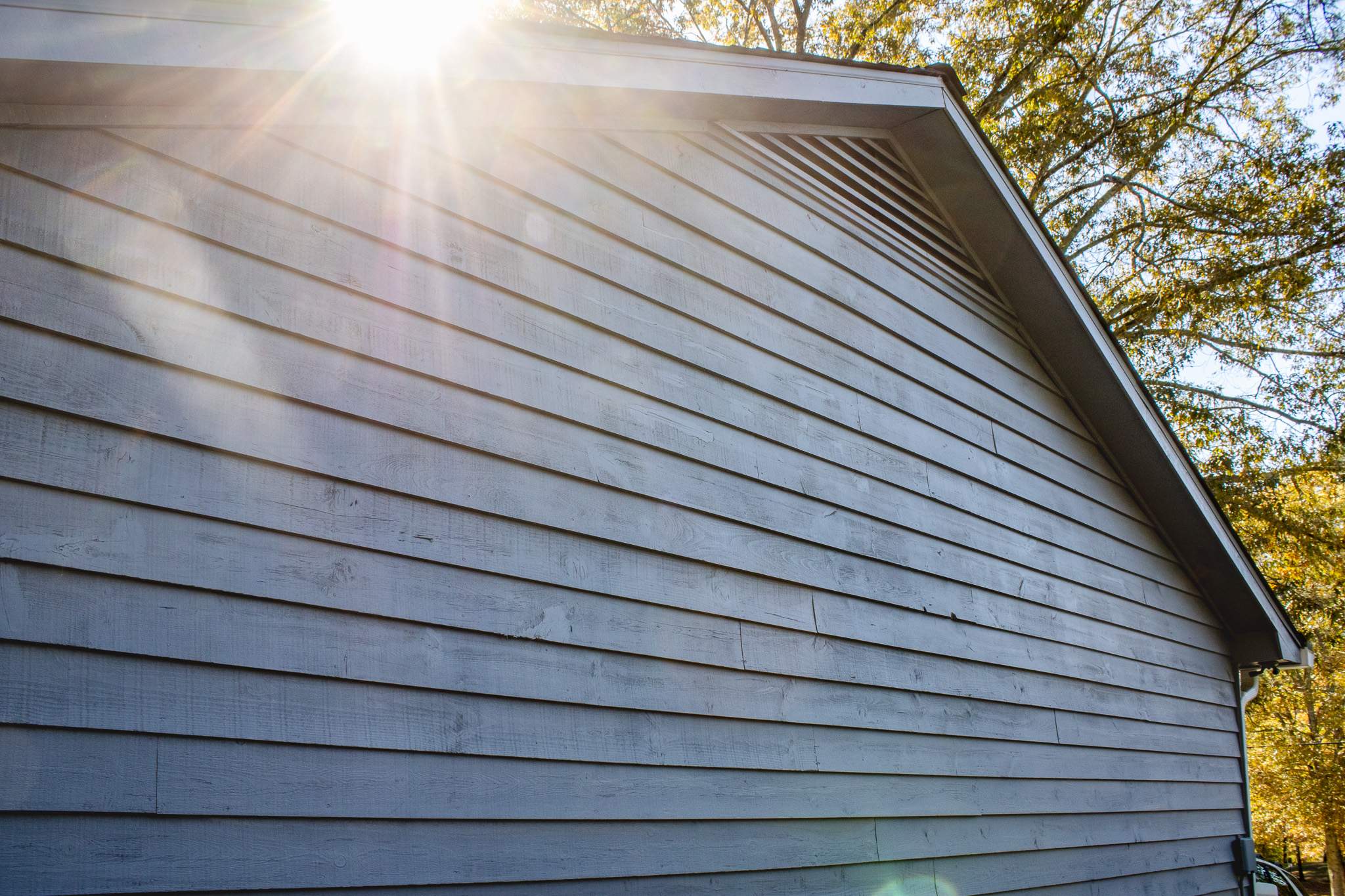 Marietta, GA Exterior Painting Transformation with Blue Paint by Nelson Exteriors