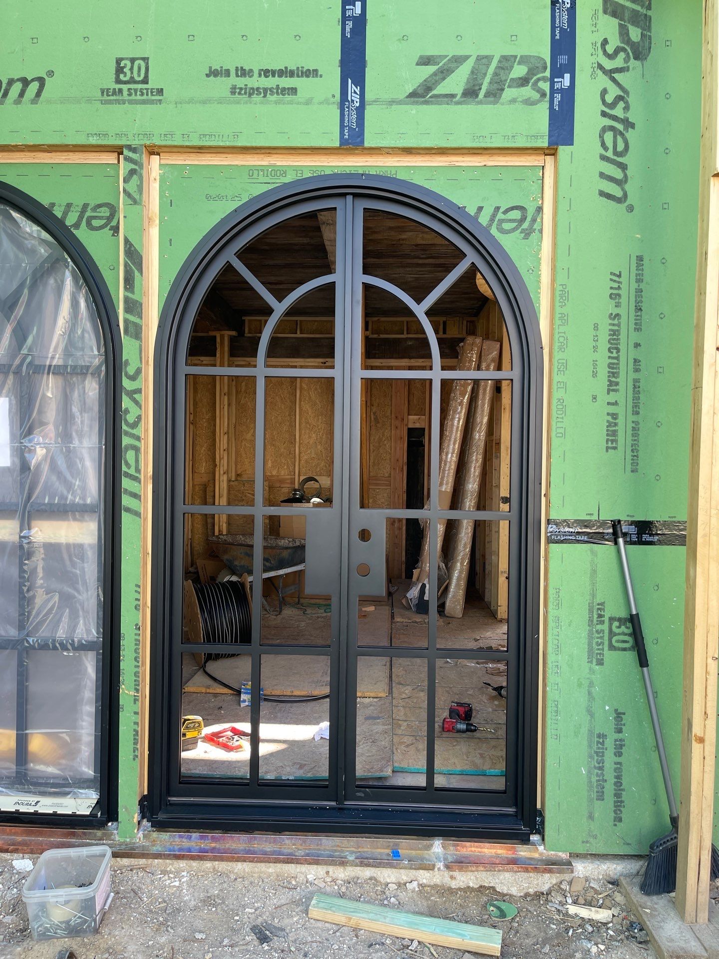 Arched Black Metal French Door Installation and Finishing in Fort Worth by Solara Custom Living