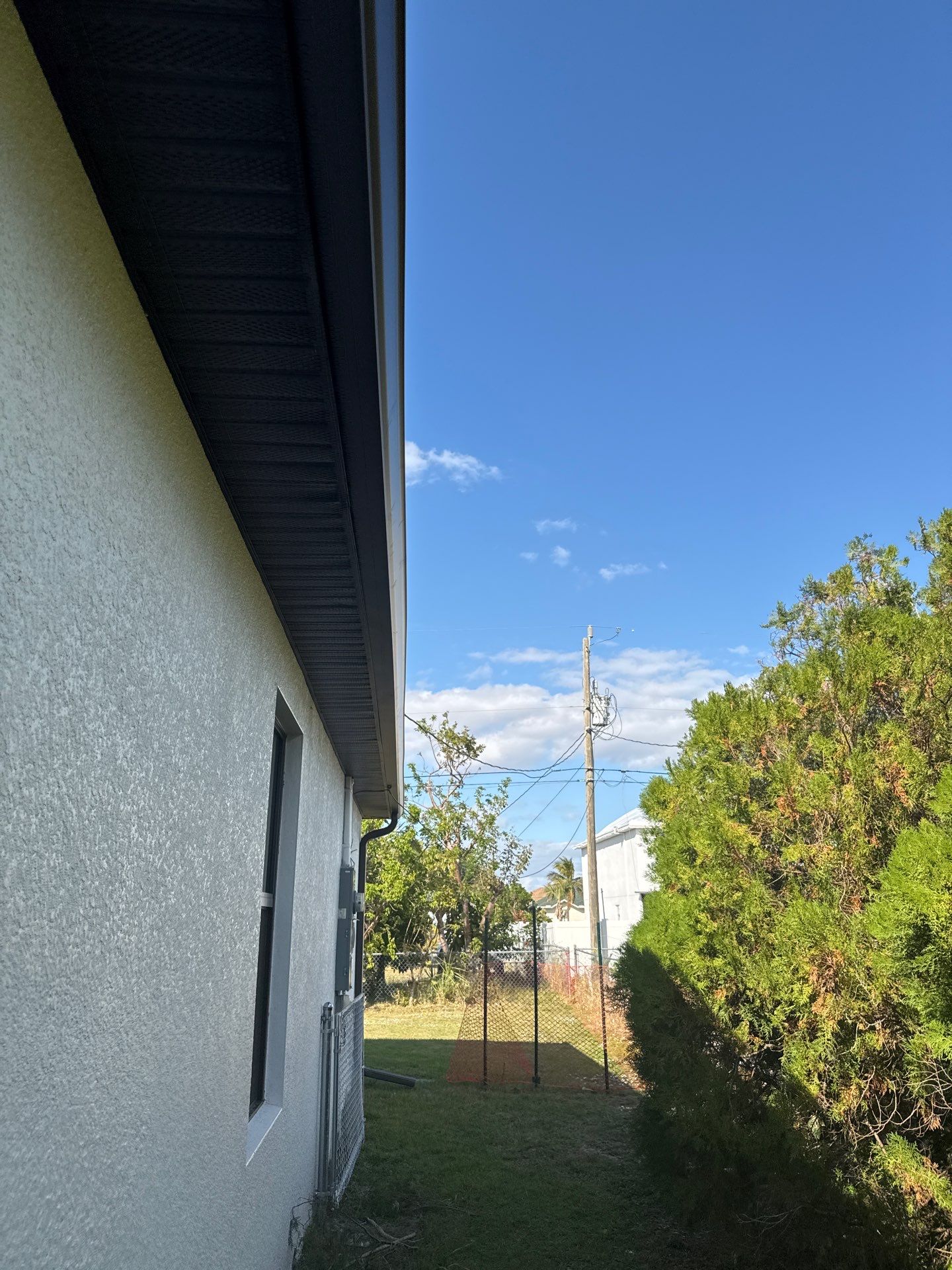 Dark Seamless Gutters and Downspouts in Cape Coral FL by Gutter Professors