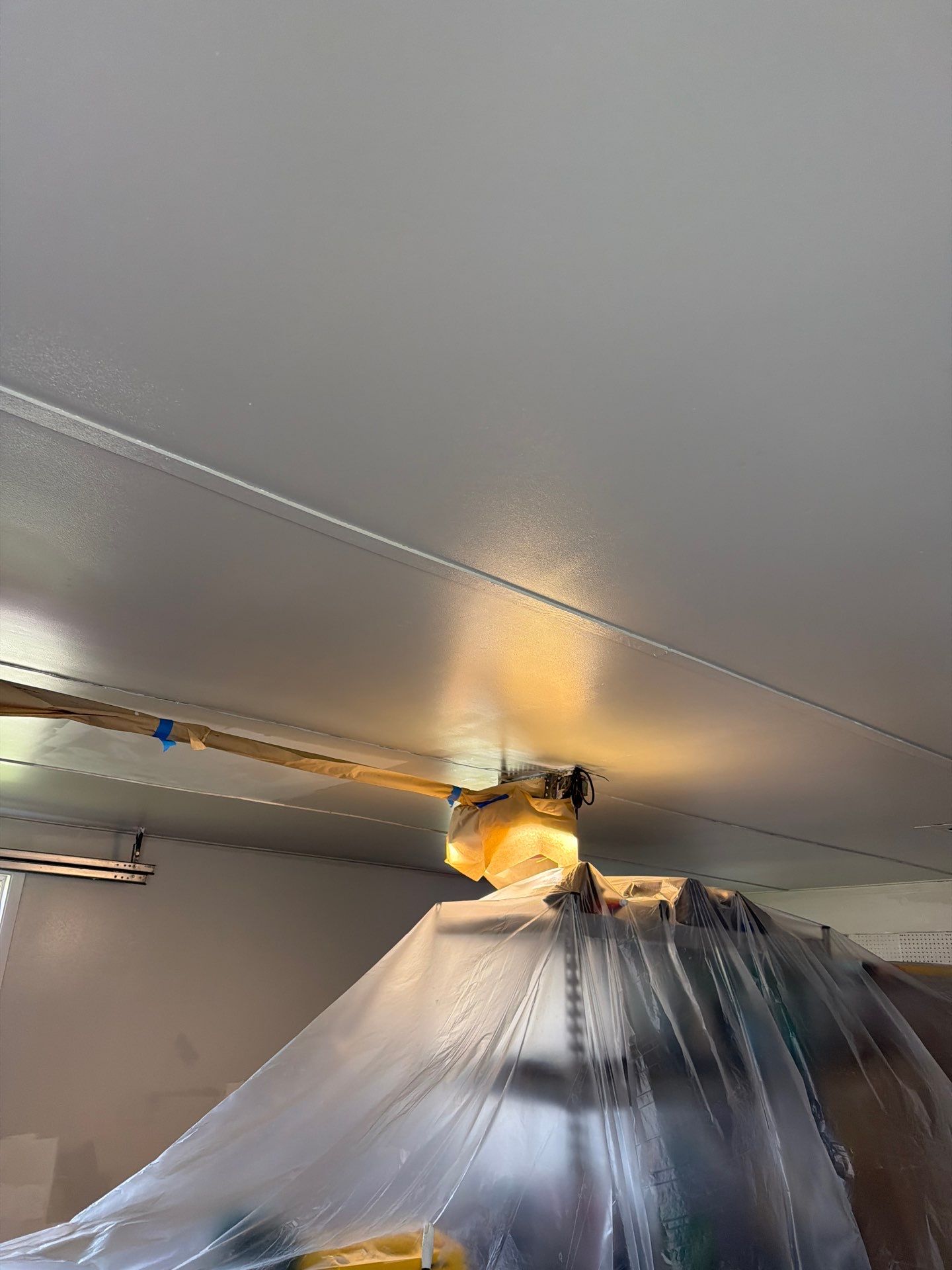 Muskegon Garage Interior Painting and Epoxy Flake Floor Installation by Gordon Painting