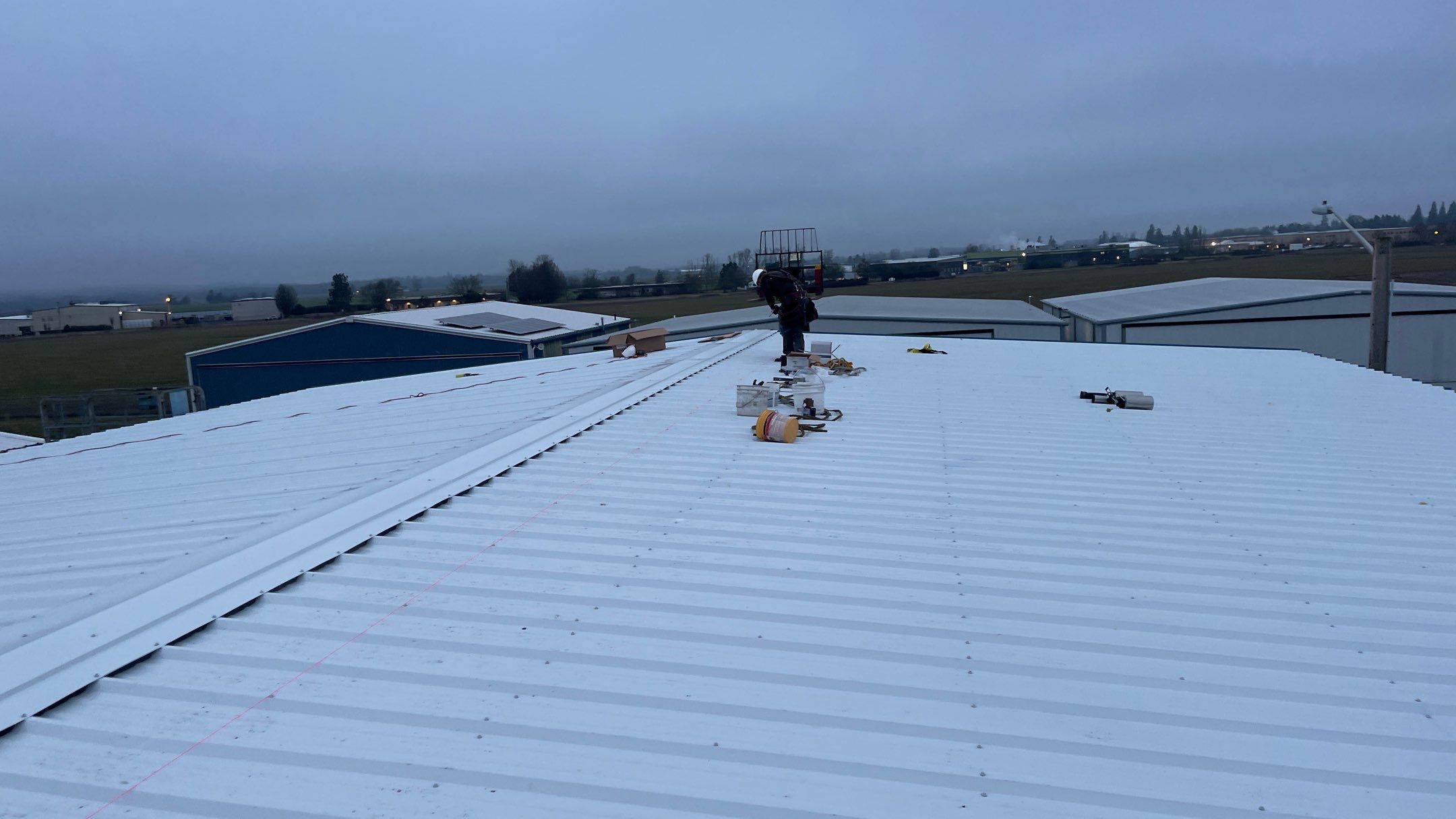 Airport Hanger Metal Roof Replacement and Insulation by Villegas Remodeling, LLC