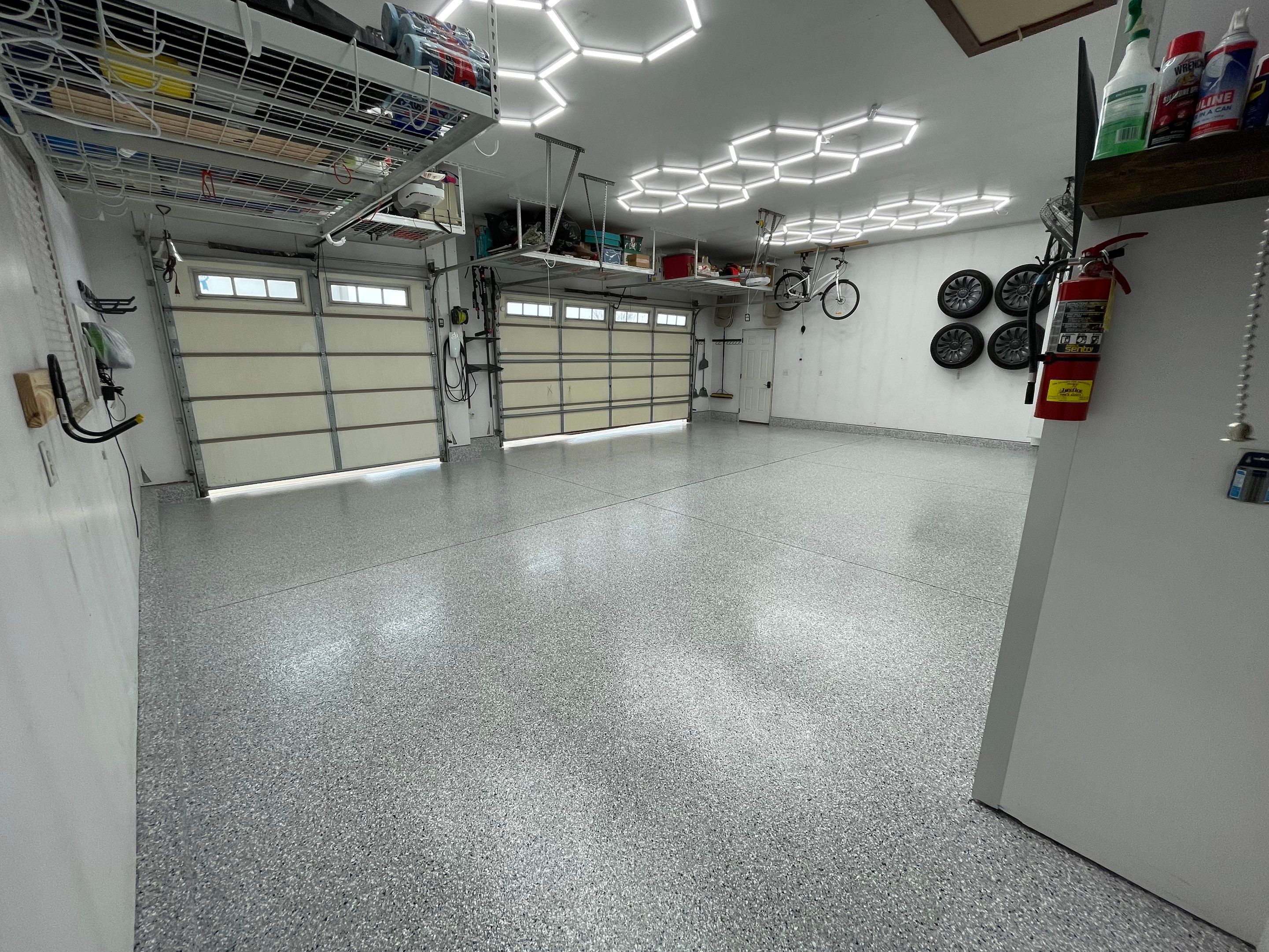 Feather Gray Epoxy Floor Coating Installation in Sioux Falls by Select Painting, Coatings & Garage Cabinets