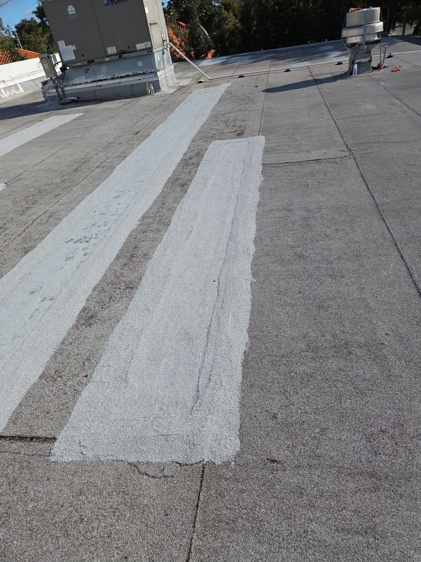 Commercial Flat Roof Restoration Using Silicone Coating in Hallandale Beach by Aastro Roofing