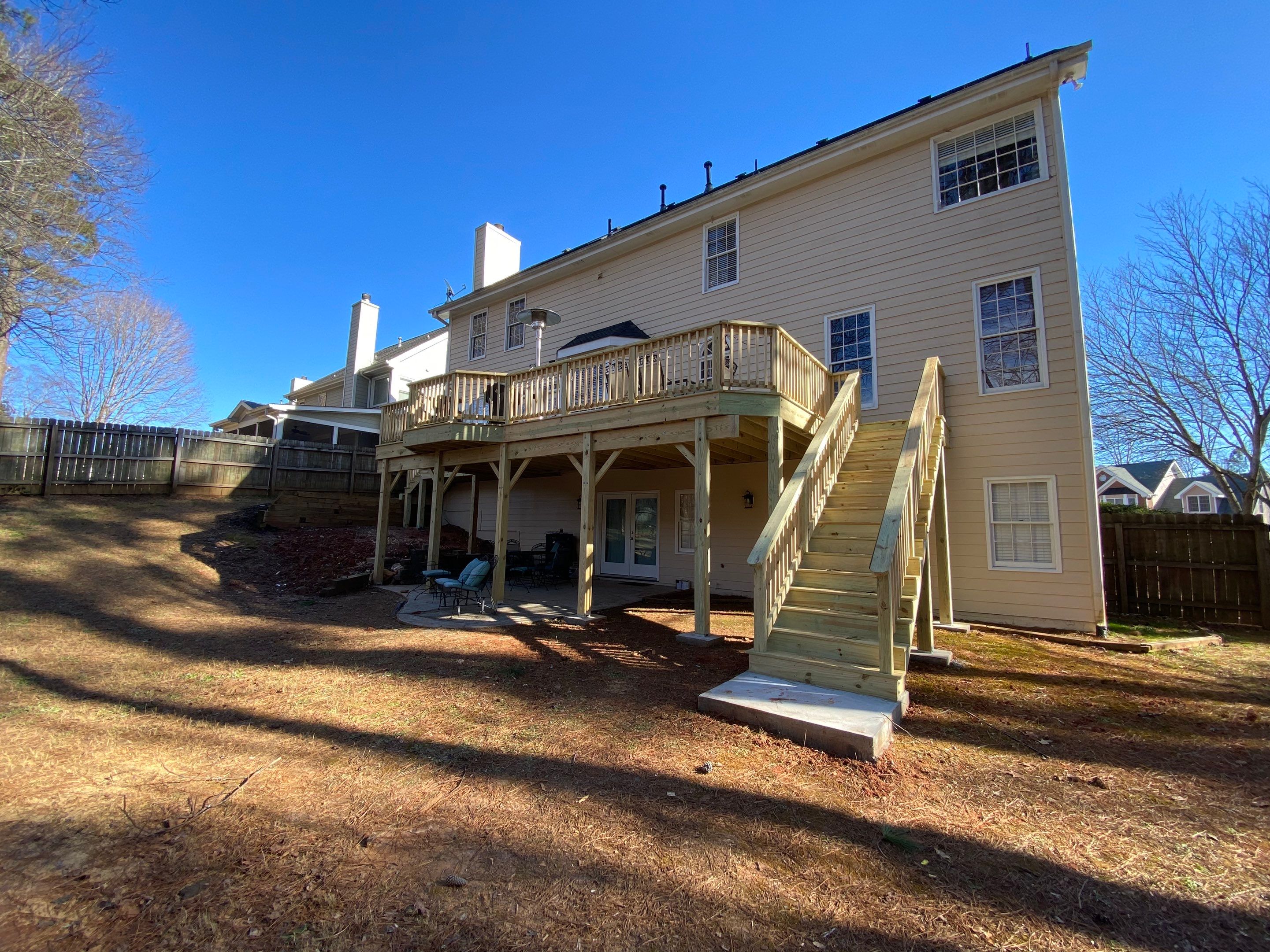Elevated Pressure-Treated Wood Deck Replacement and Staircase in Duluth by Swift Home Renovations